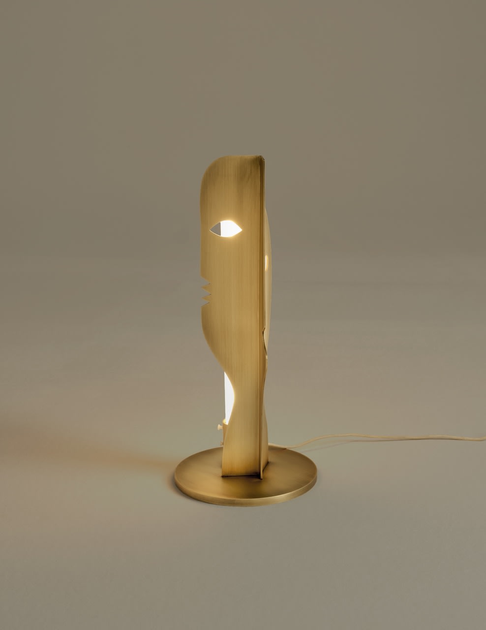 Deramo Lamp — side view highlighting brass material and light source