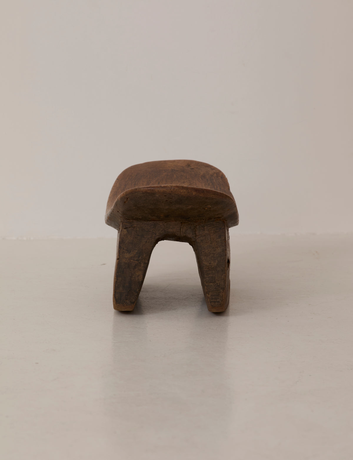 Mid-Century African Senufo Stool in Solid Wood — top view of solid wood seat