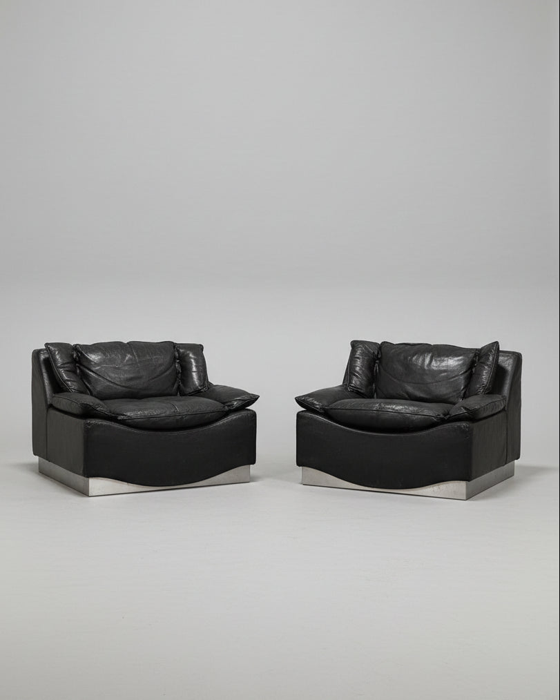 Pair of black leather armchairs with steel bases by Frigerio
