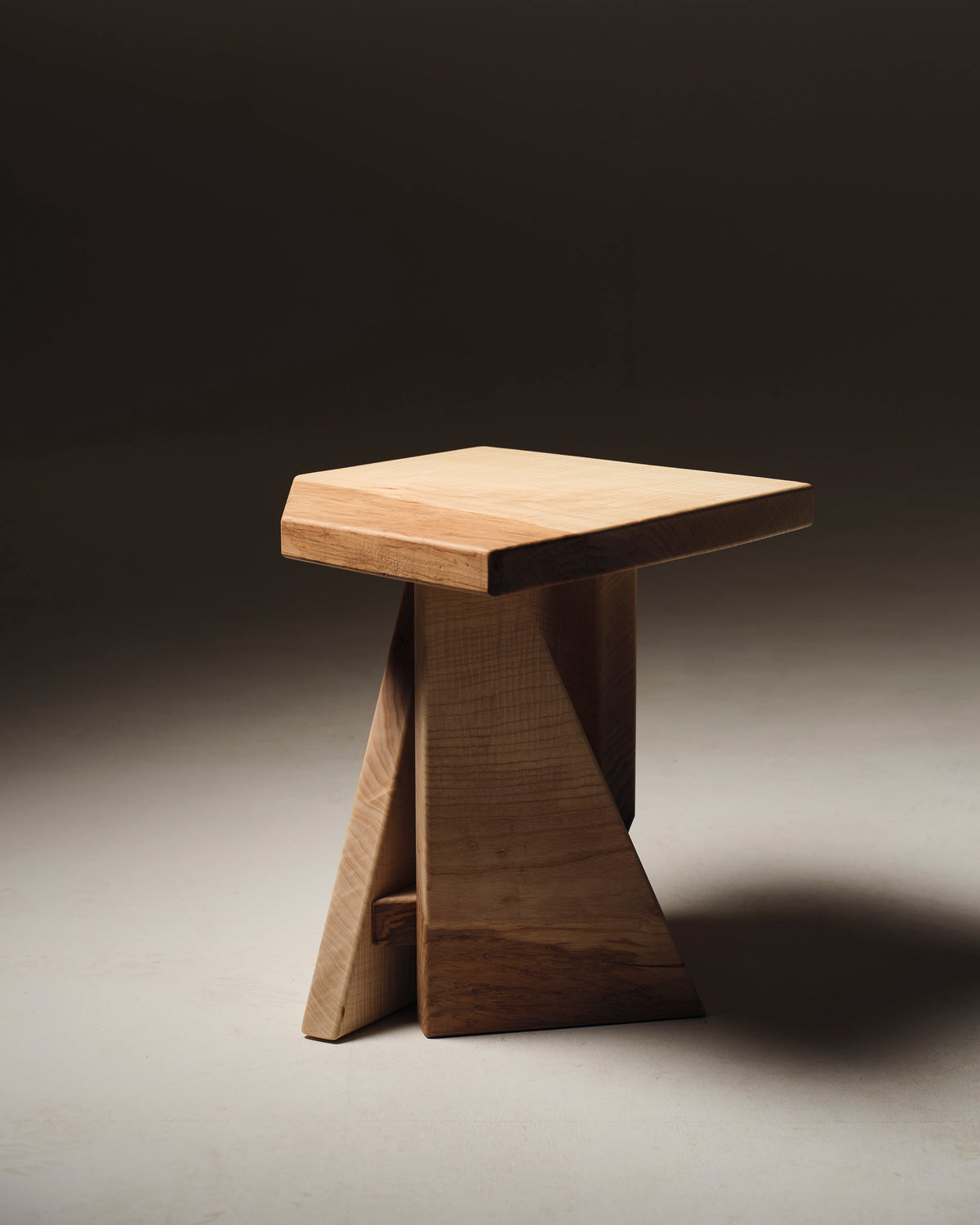 Maple wooden stool side table with curved A-frame base detail