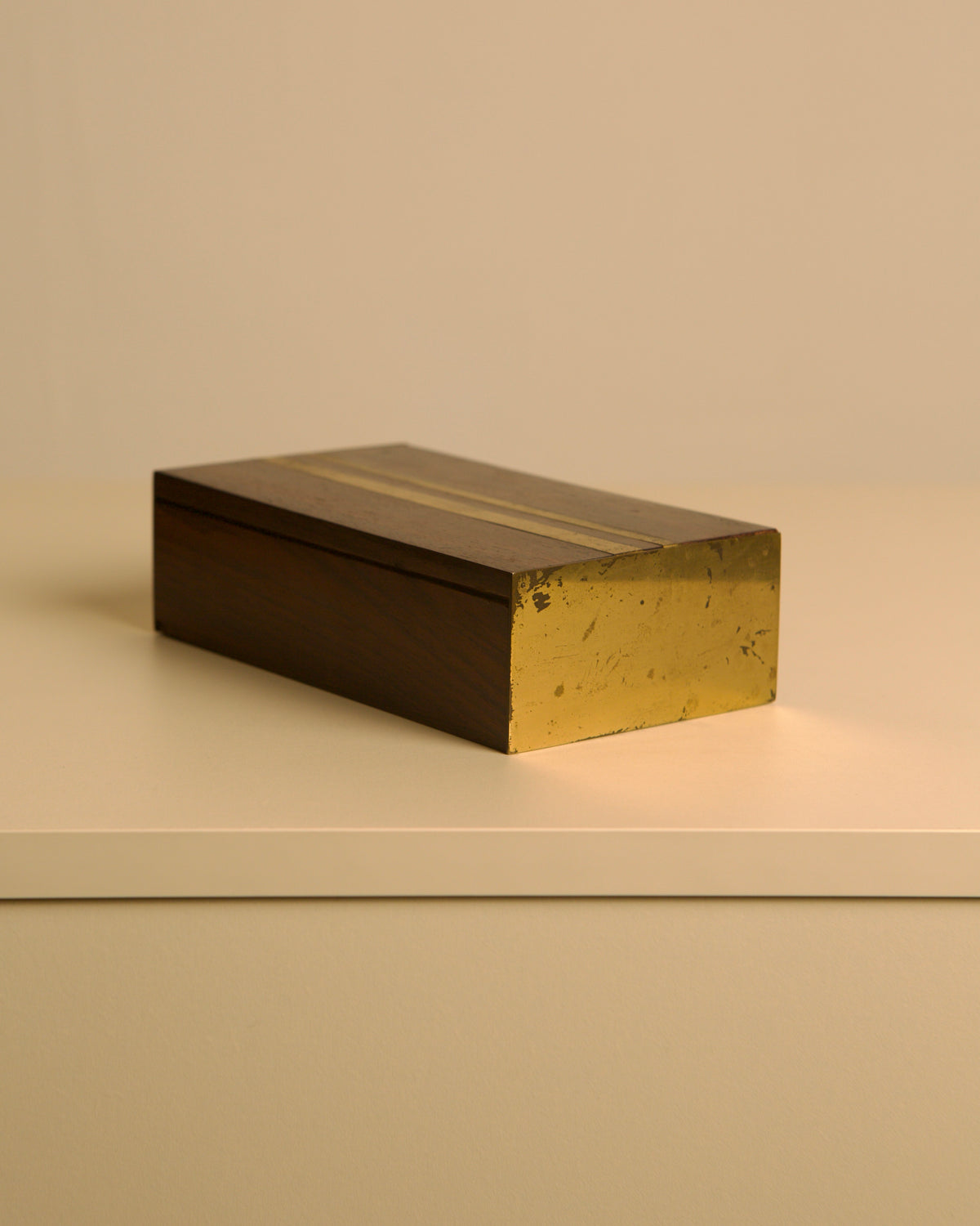 Italian Box in Handcrafted Wood and Patinated Brass, 1950s — angled view on neutral surface