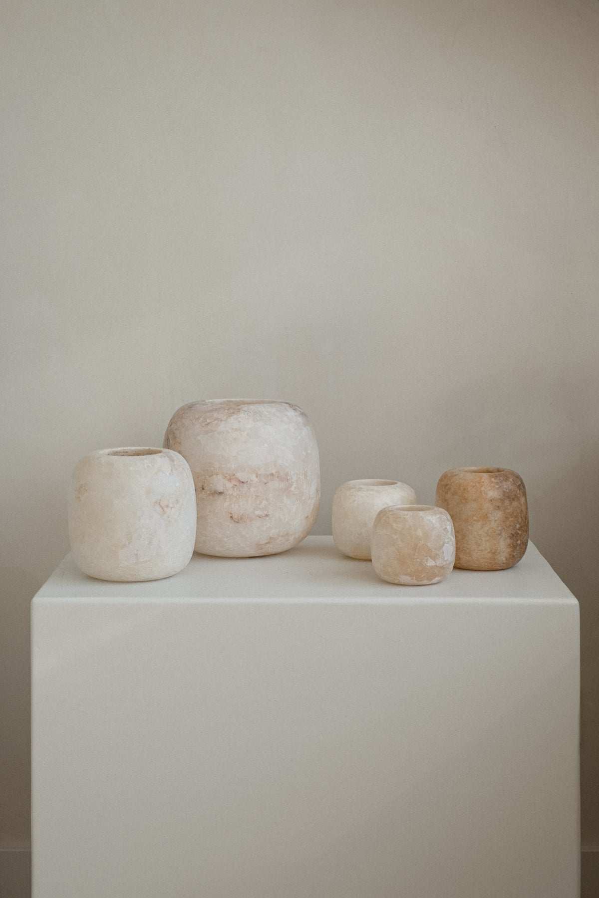 Alabaster Candle Holder — arranged on white pedestal with neutral background