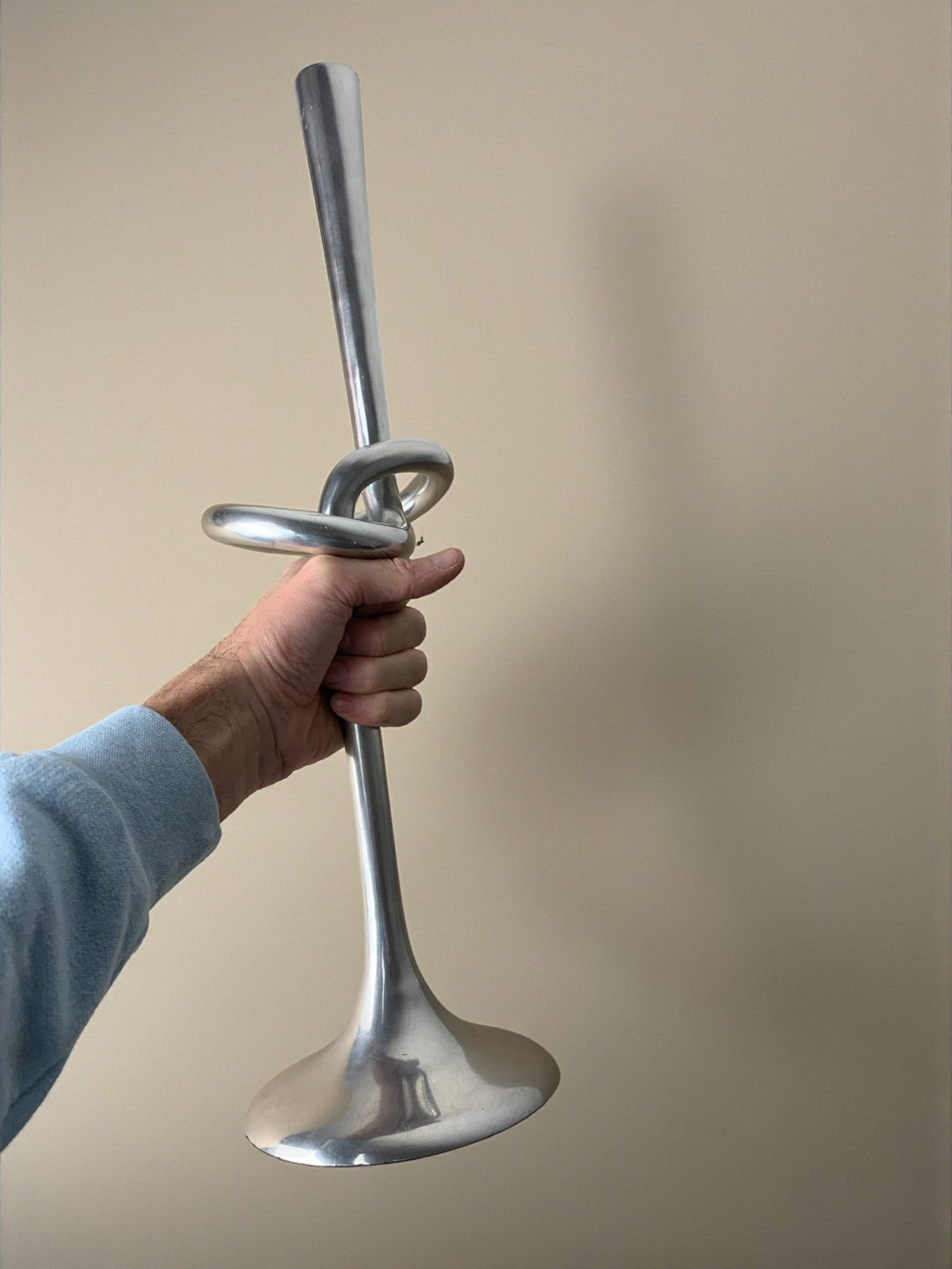 XL knotted candlestick in Solid aluminum, Italy, 1980 — side angle