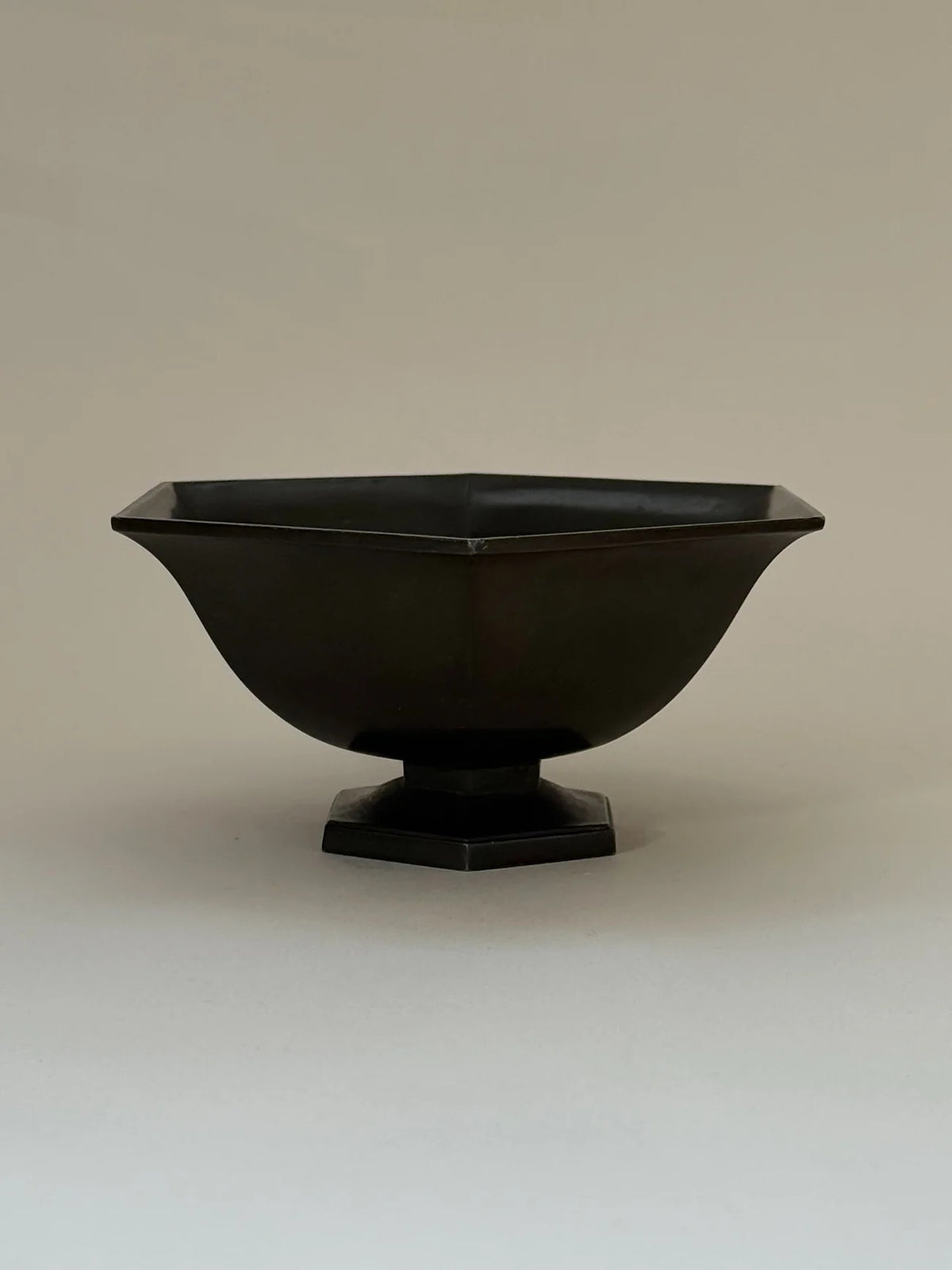 Hexagonal Just Andersen Bowl in Disko Metal — front view on neutral background