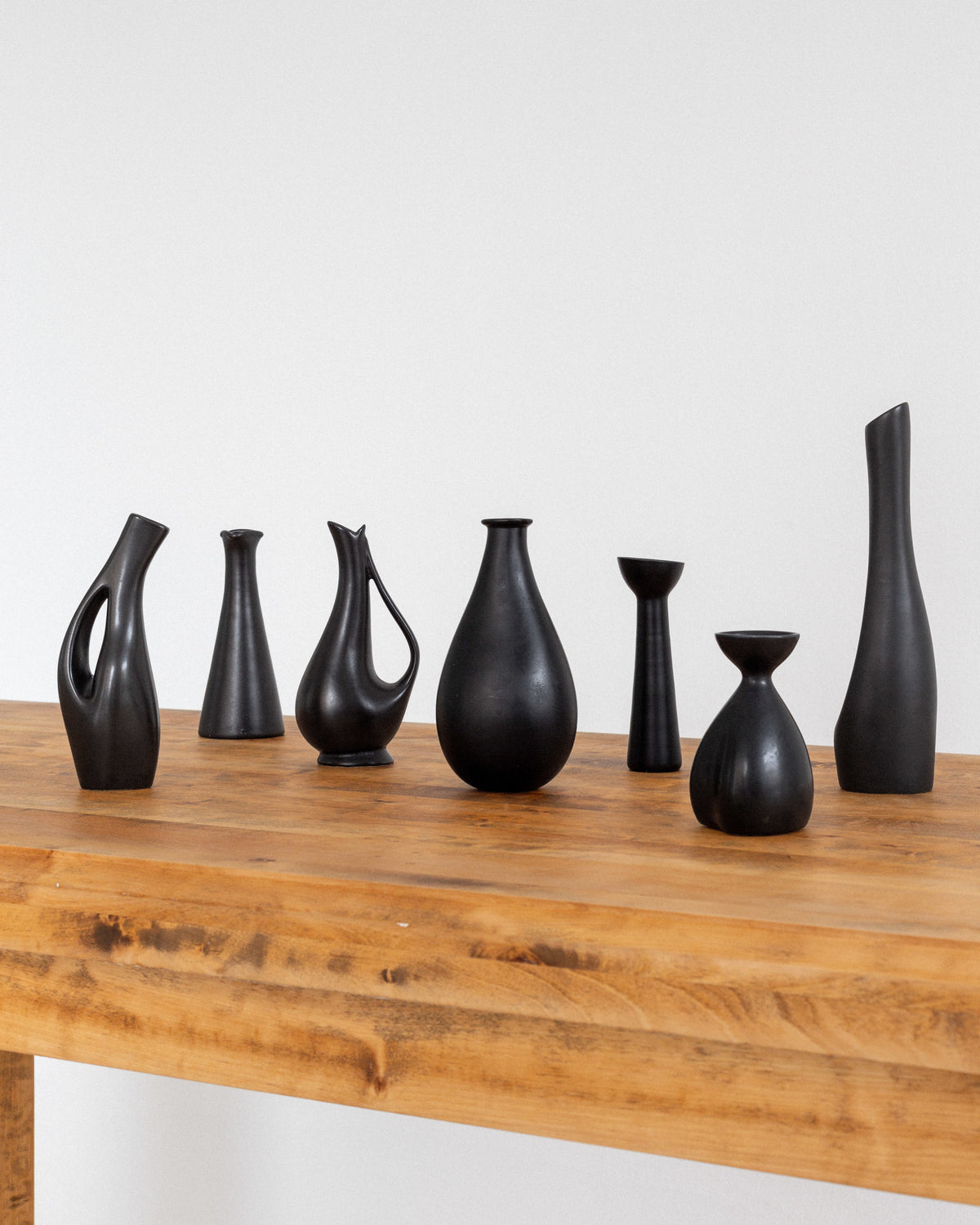 Collection of Black Sculptural Vases, Swedish Mid-Century Modern — side angle on wooden table