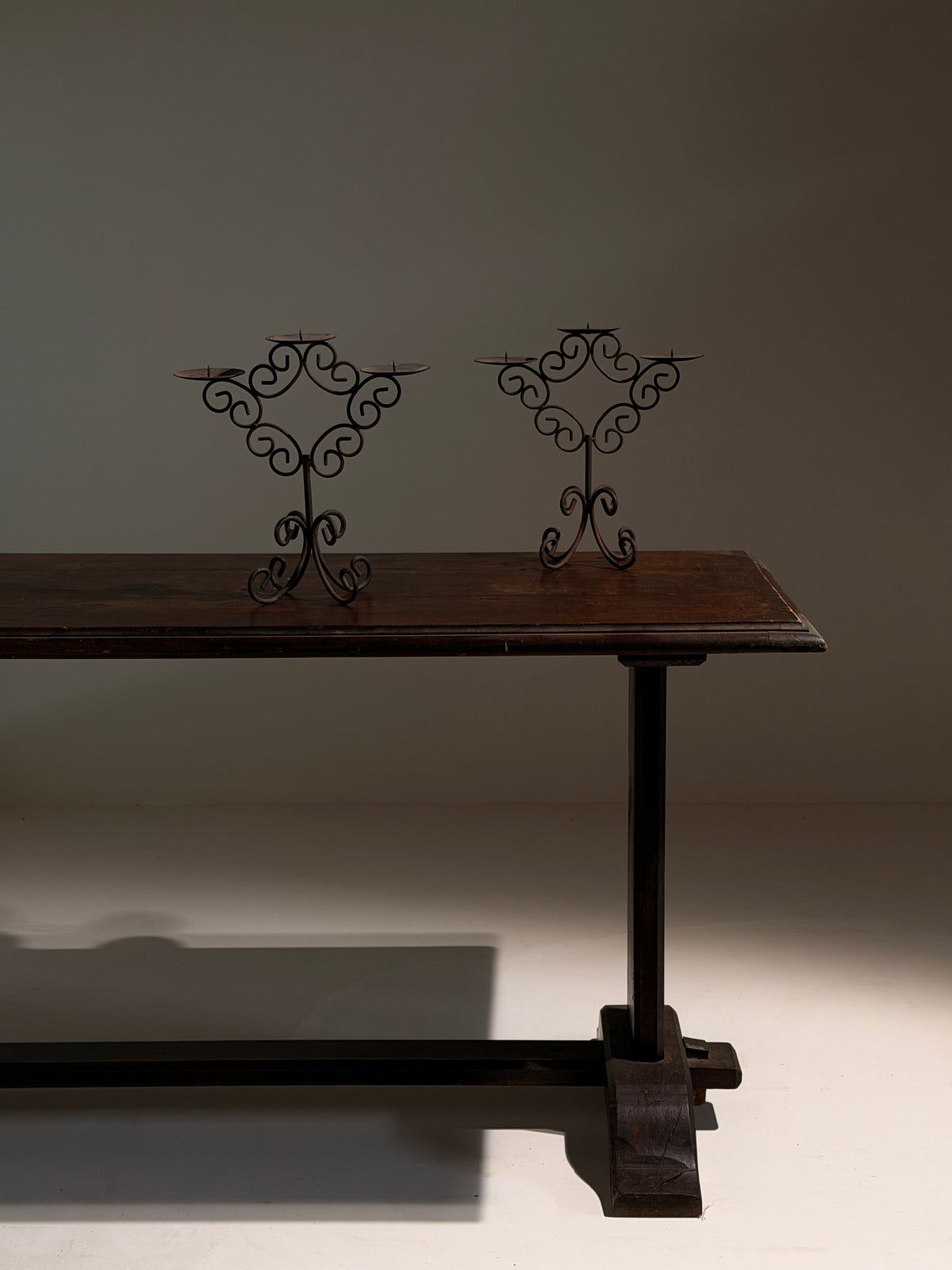 Pair of three-light wrought-iron candleholders, circa 1950 — detail view