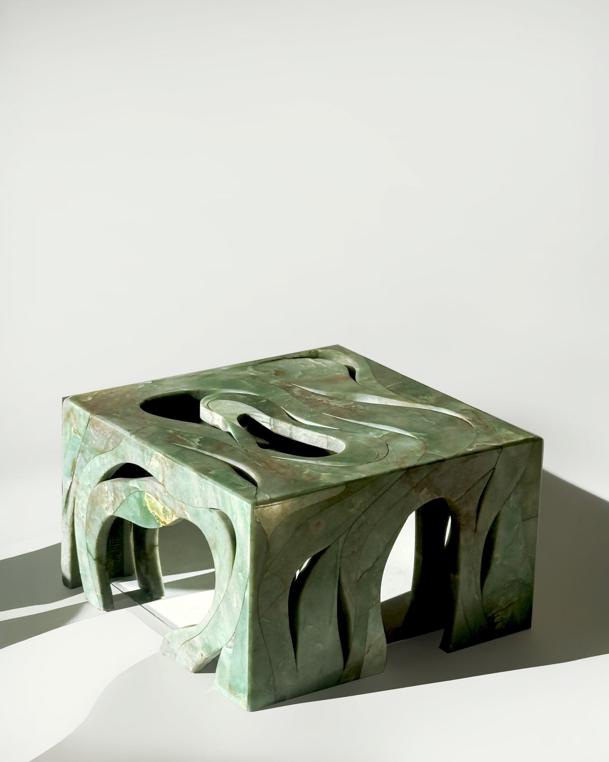 Orbis' Marble Side Table — angled view highlighting green marble design