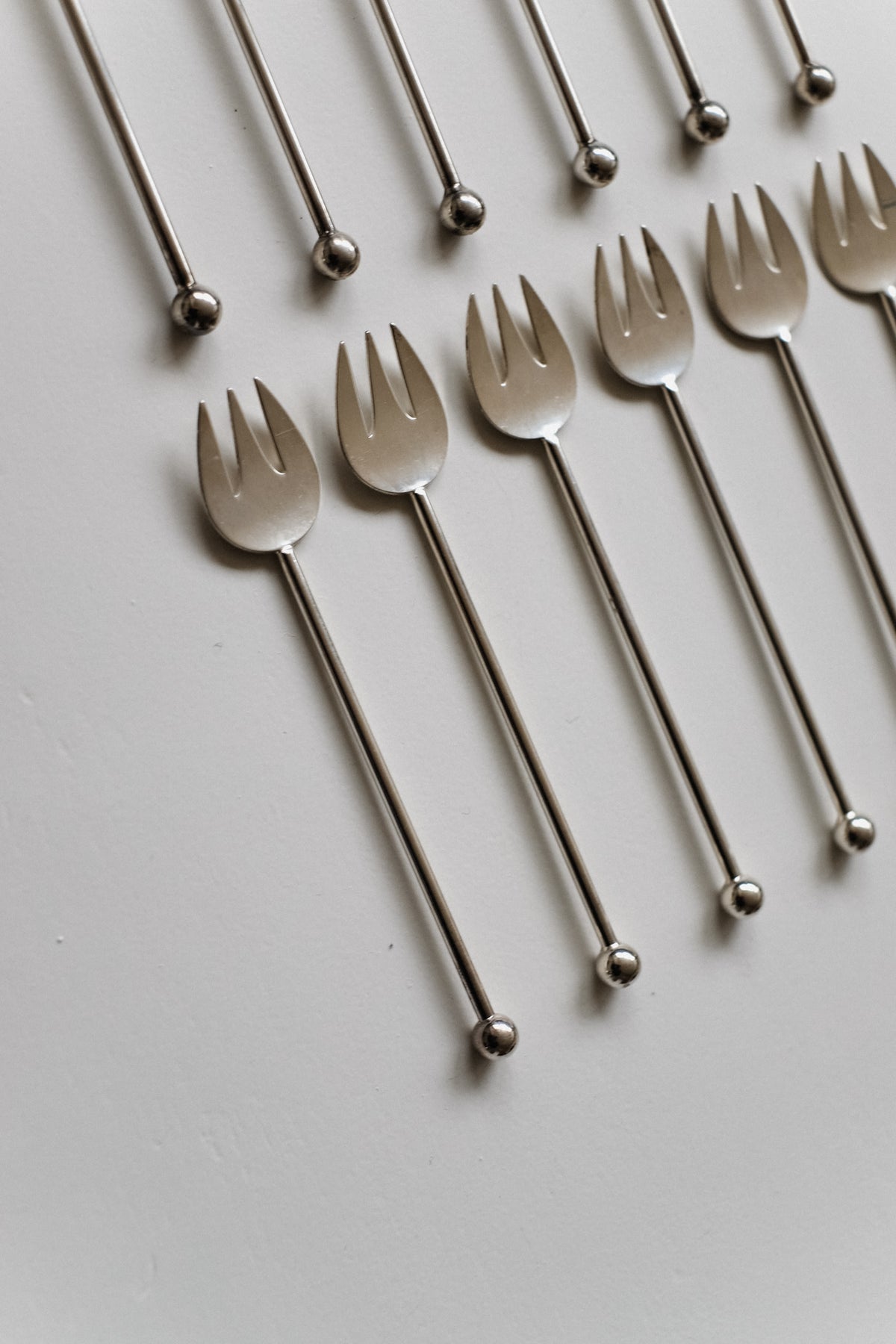 Silver-Plated Cutlery Set — close-up of fork tines on white background