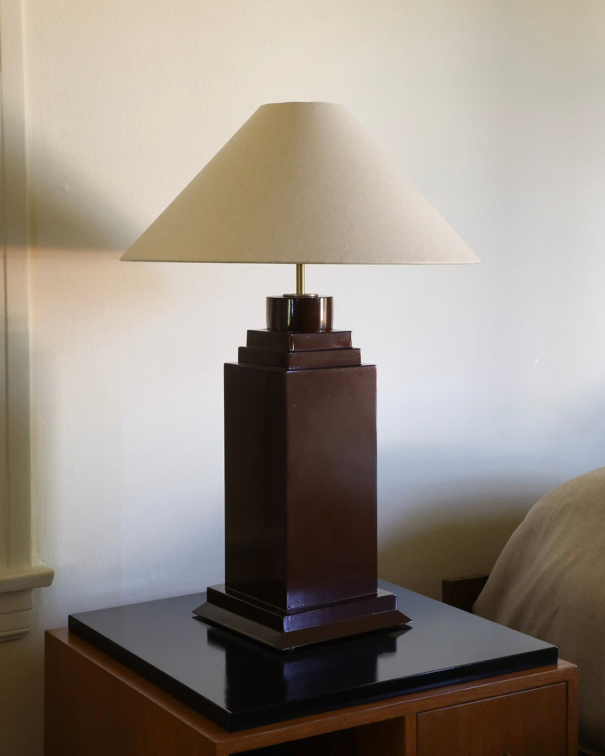 Hudson table lamp dark lacquered stepped base with cream shade