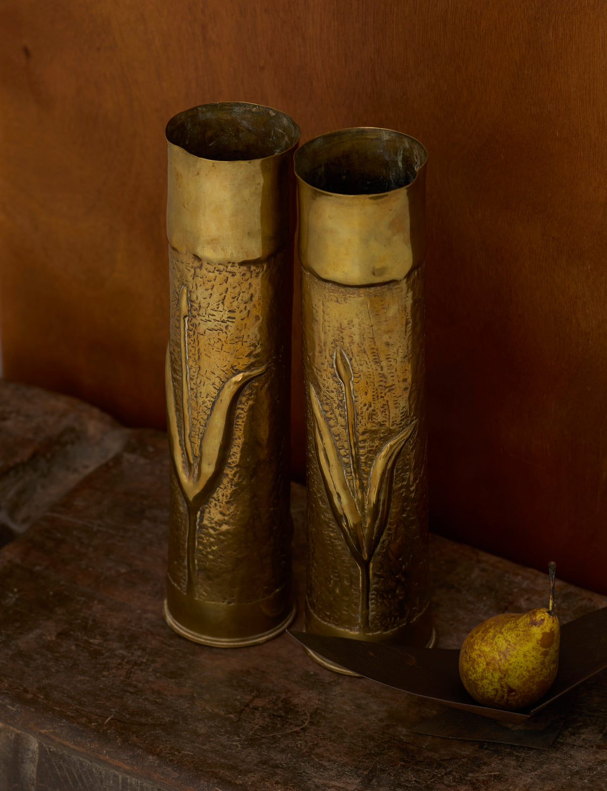 Set of 2 Vintage Vases in Metal Brass — close-up of textured brass surface with floral design