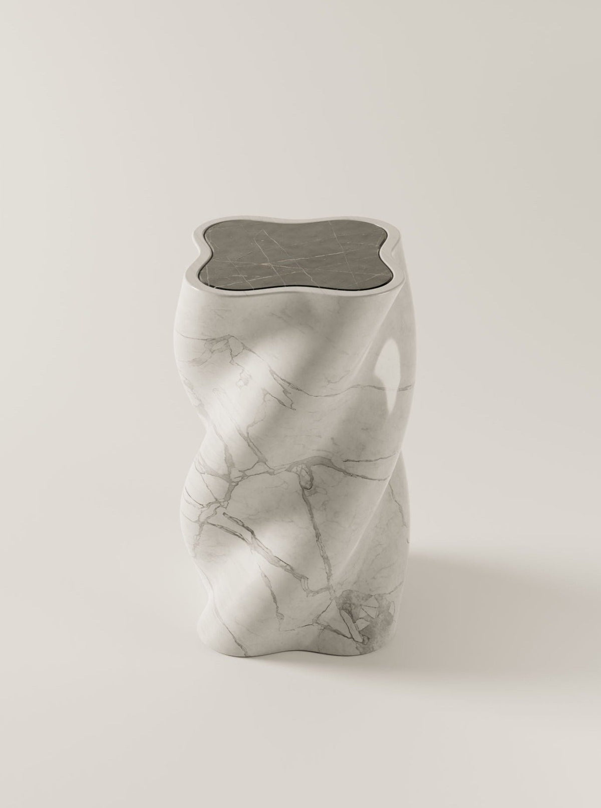 White marble end table with fluid sculptural form and veined pattern