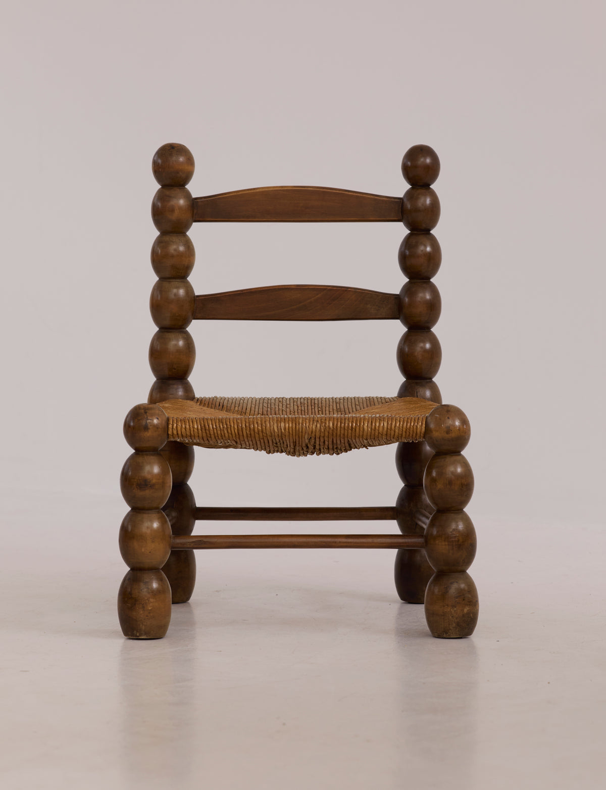 Vintage French Oak Wood and Straw Low Chair C. 1940 — back view highlighting rounded wooden details