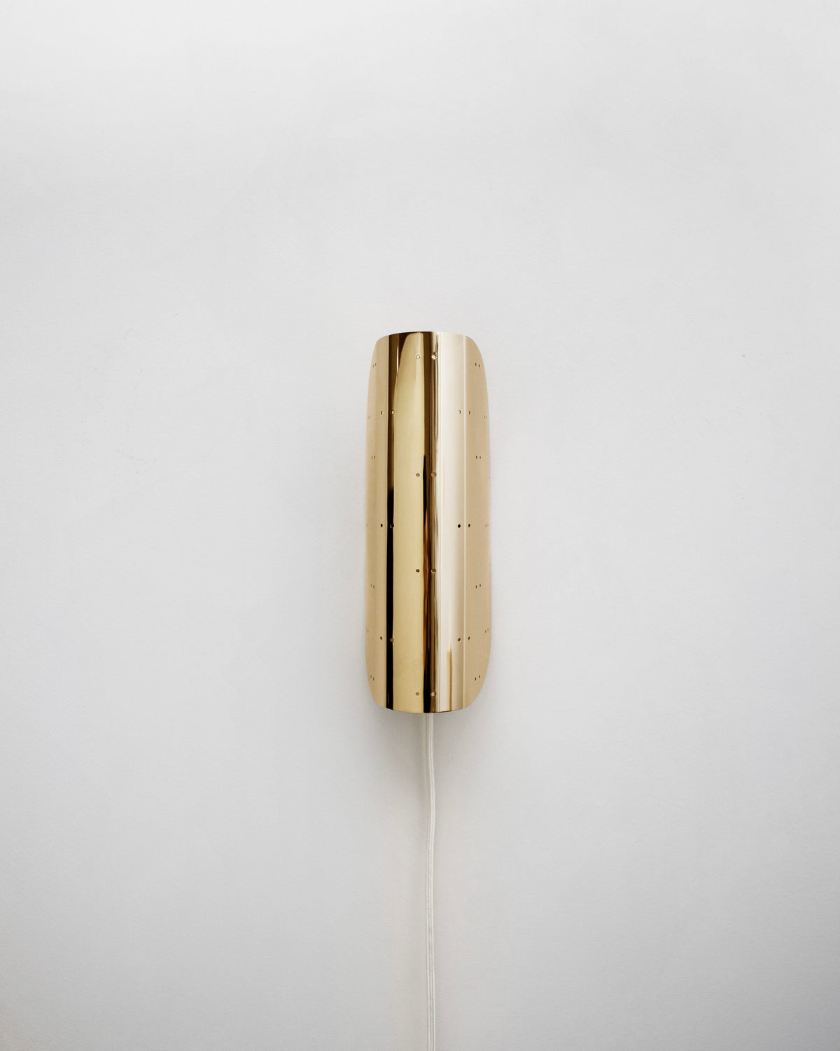 Giselle Wall Lamp - Polished Brass — side angle showing smooth brass finish