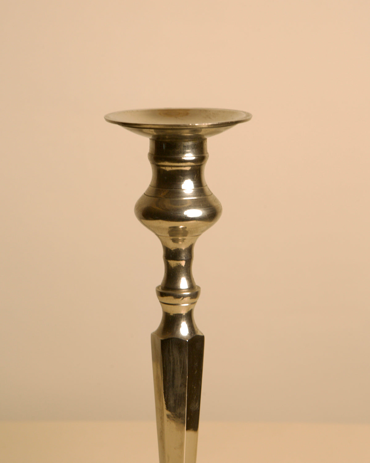 Large Italian "Column" Metal Candleholder, 1960s — side angle highlighting polished metal finish