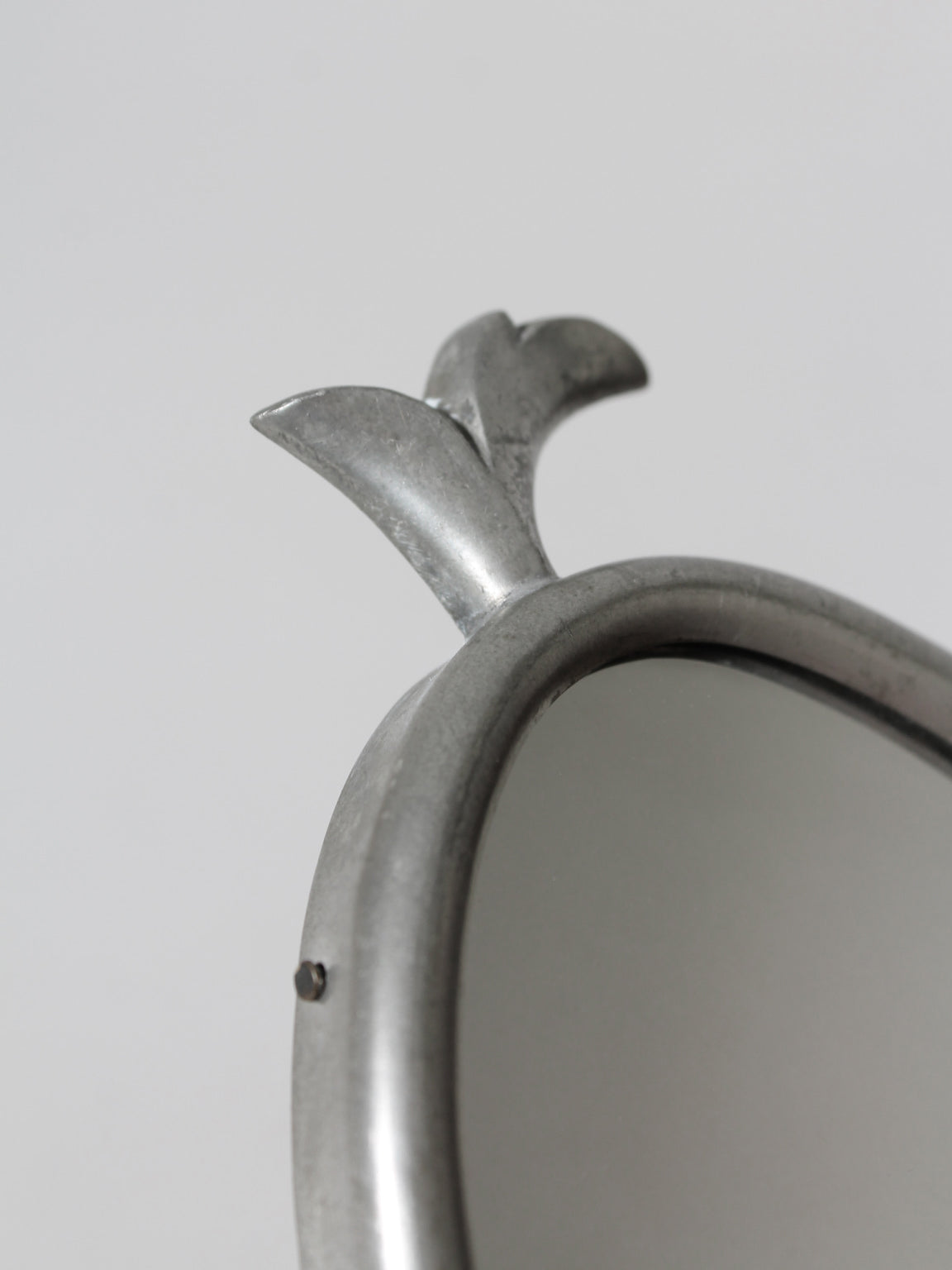 Art Deco Pewter Wall Mirror-Candle Holder, 1930s, Sweden — close-up of pewter detail with decorative top