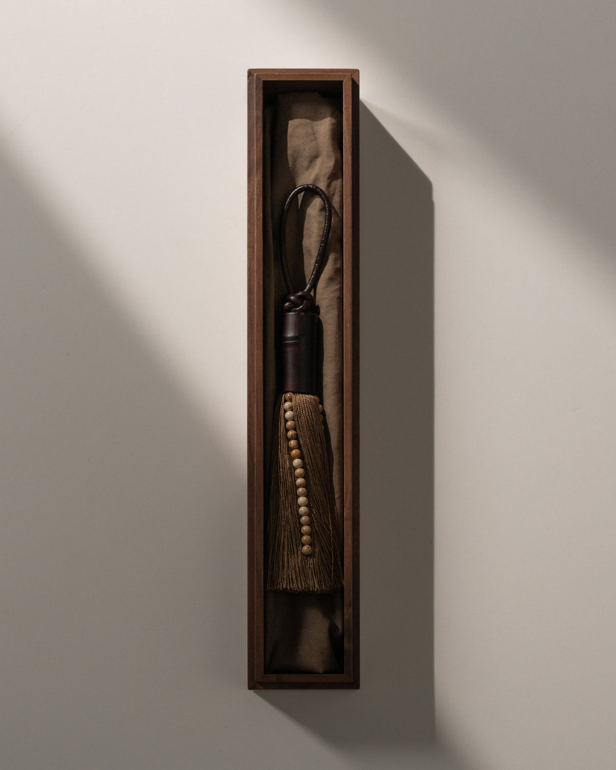 Elegant black tassel ornament with wooden beads in display box