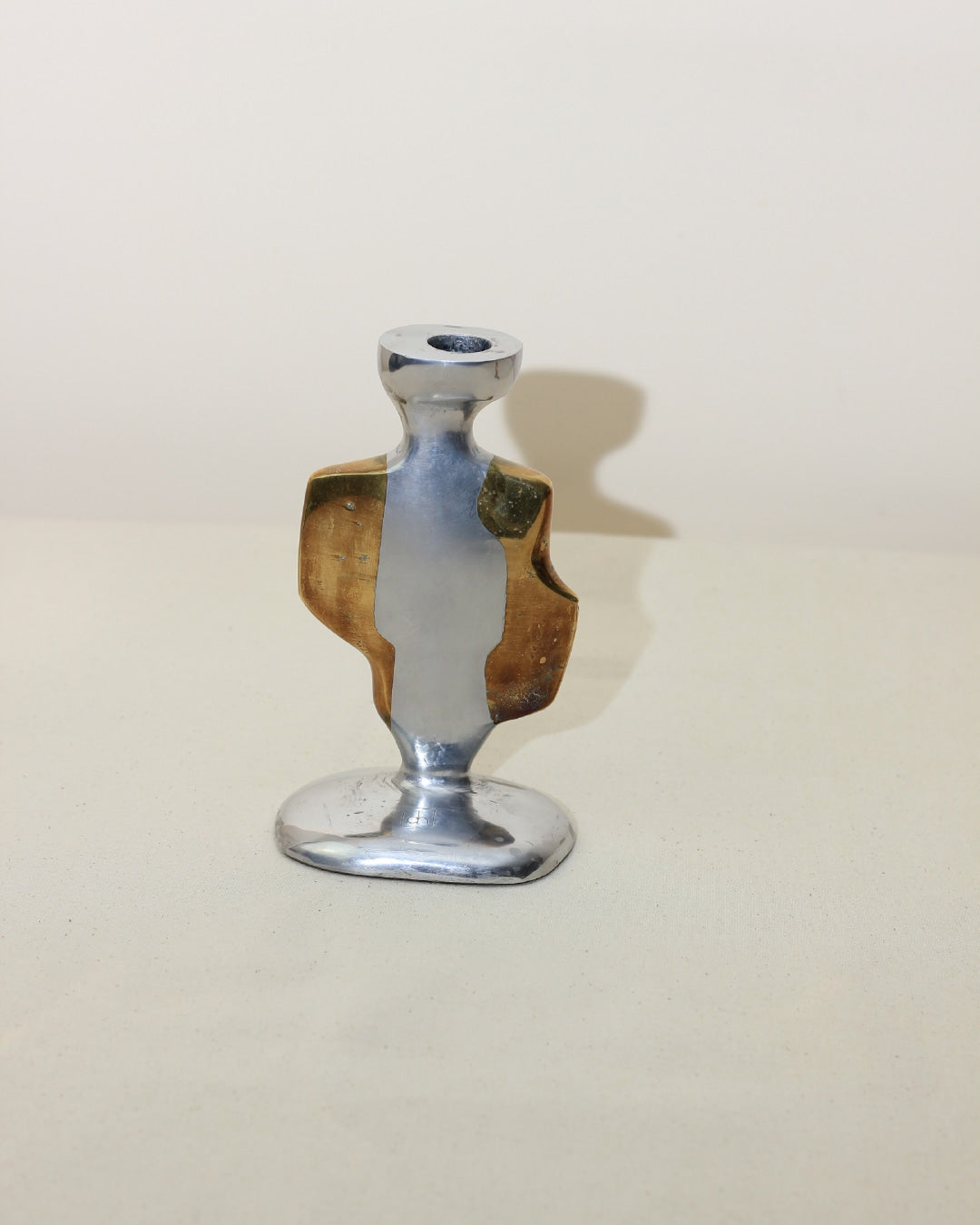 Brutalist Candleholders — close-up of polished metal and brass detail