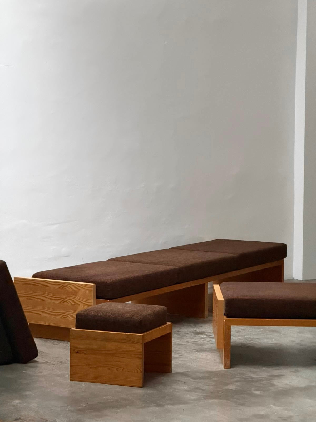 Modernist Benches and Stool, c.1970 — back view showing wooden frame and brown upholstery