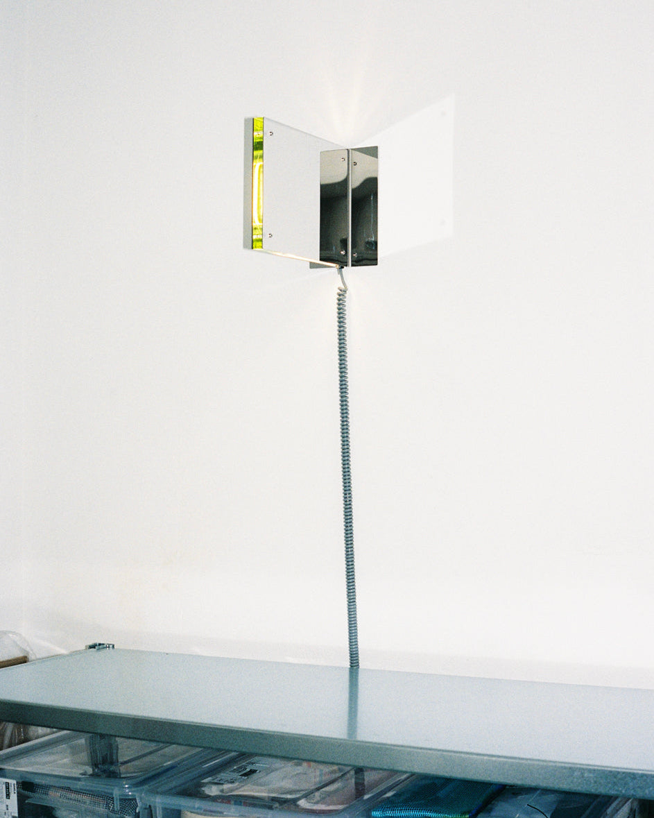 Contemporary wall-mounted table lamp with yellow fluorescent tube