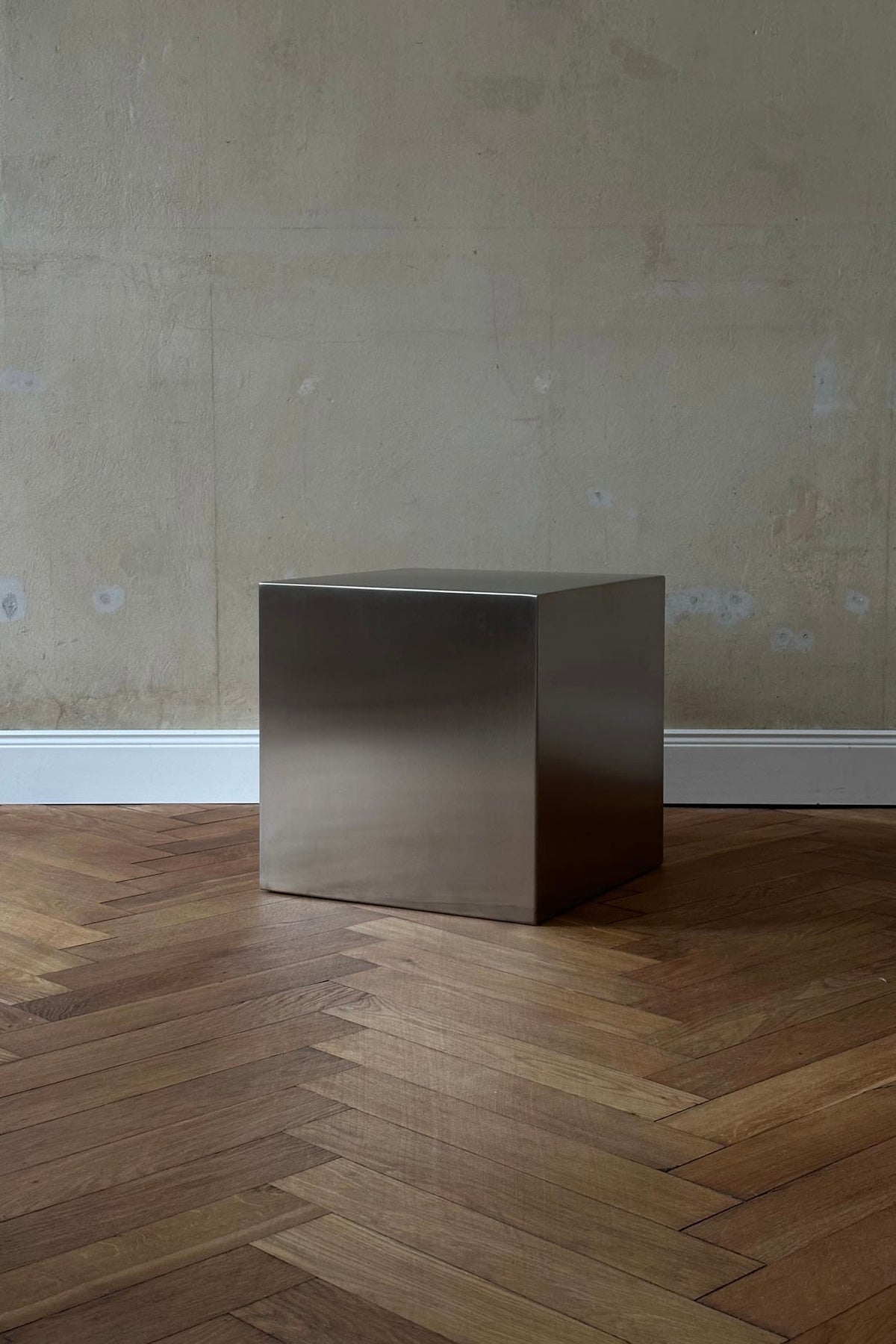 'NOSTALGIA' stainless steel cube — side angle