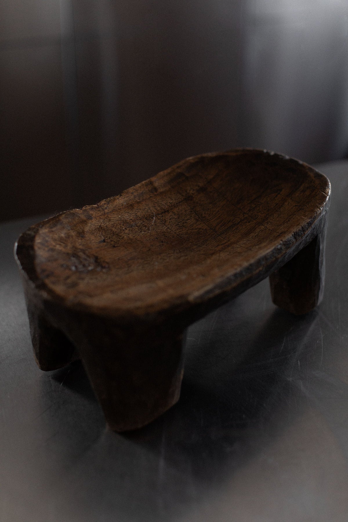 Senufo Stool — angled view of handcrafted dark wood design