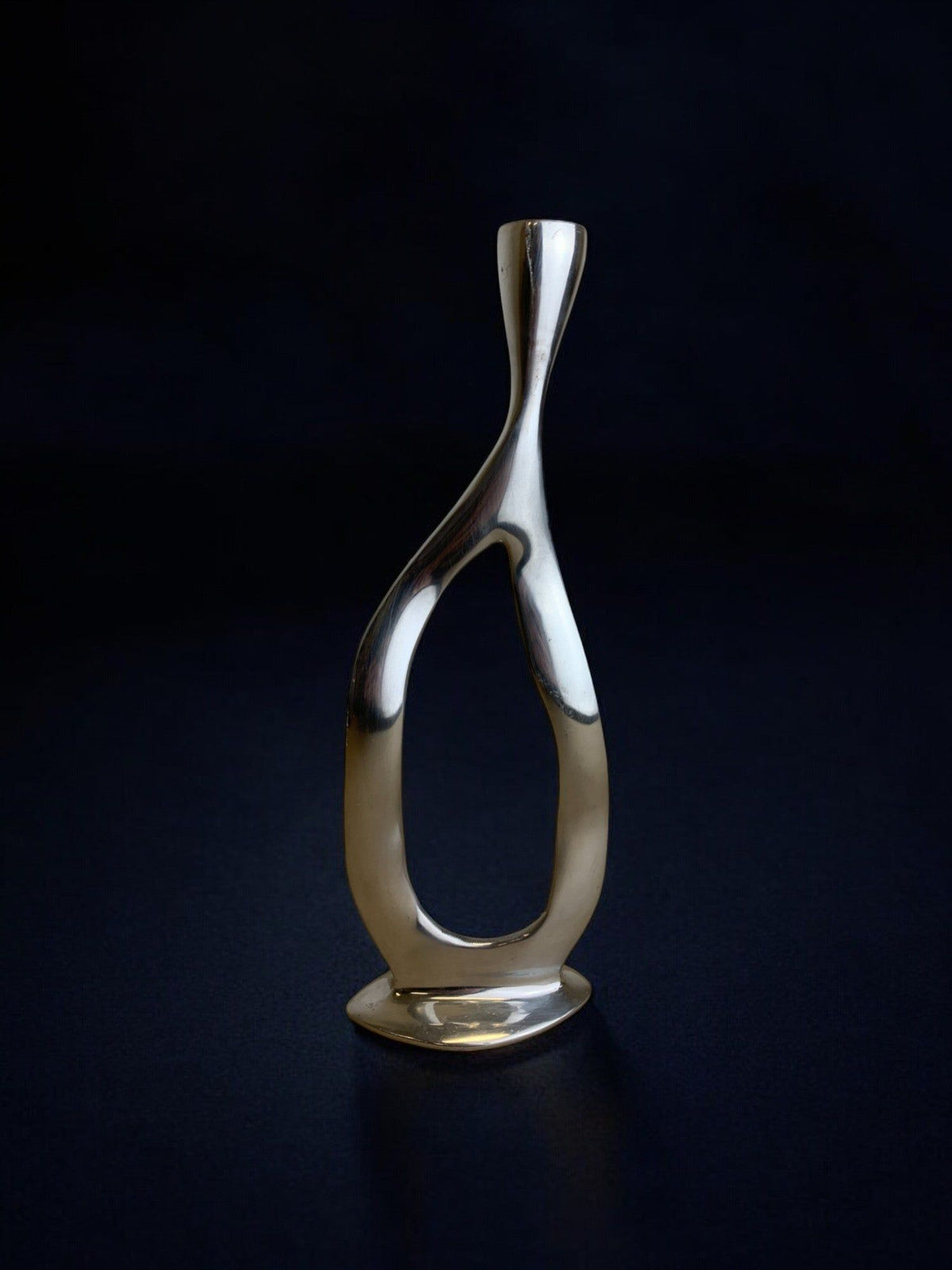 Biomorphic Candleholder, Aluminum, Spain, Circa 1970s — angled view on dark background
