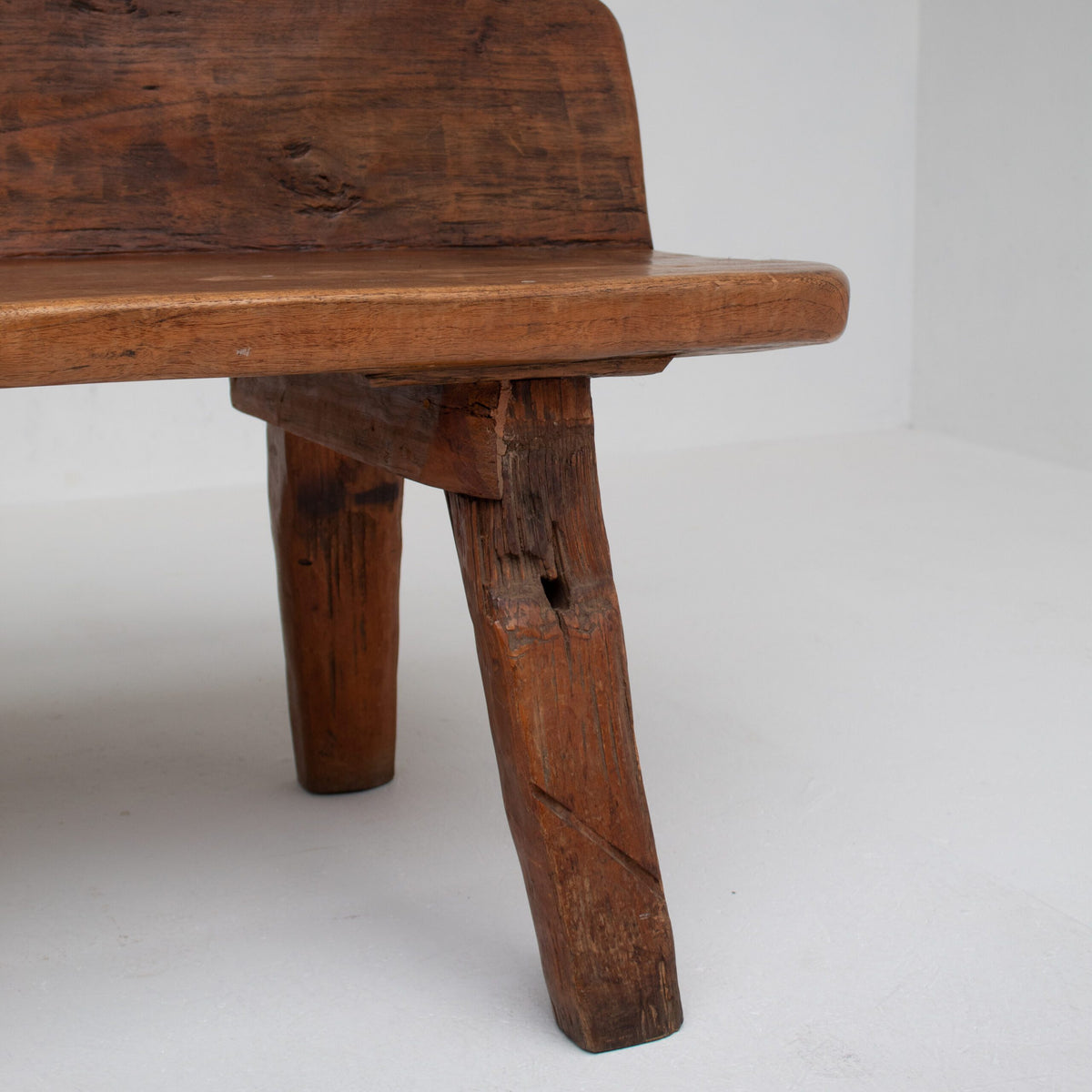 Rustic Wooden Bench — close-up of handcrafted wooden legs