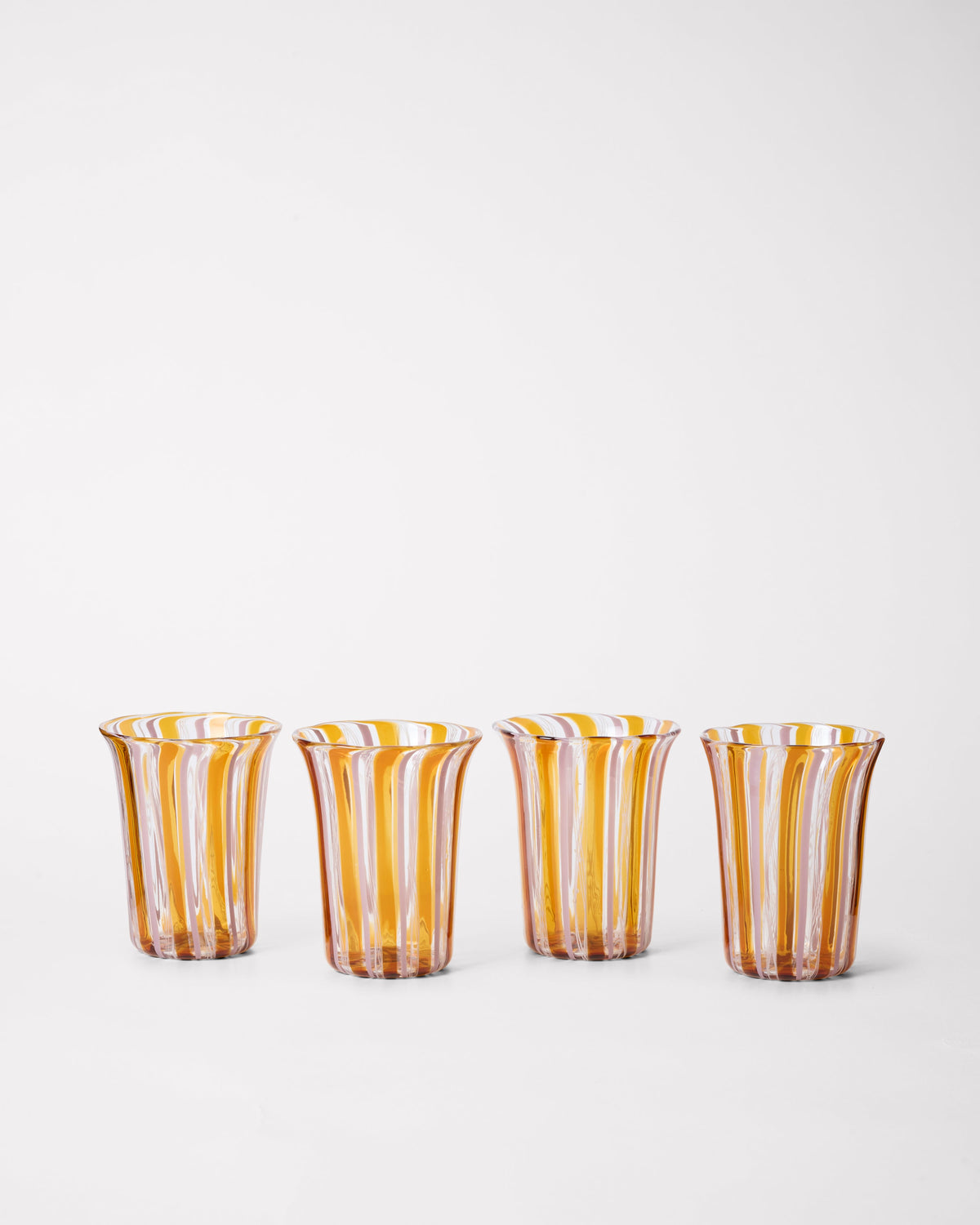 Clara Glasses - Set of four — close-up of amber striped glass design