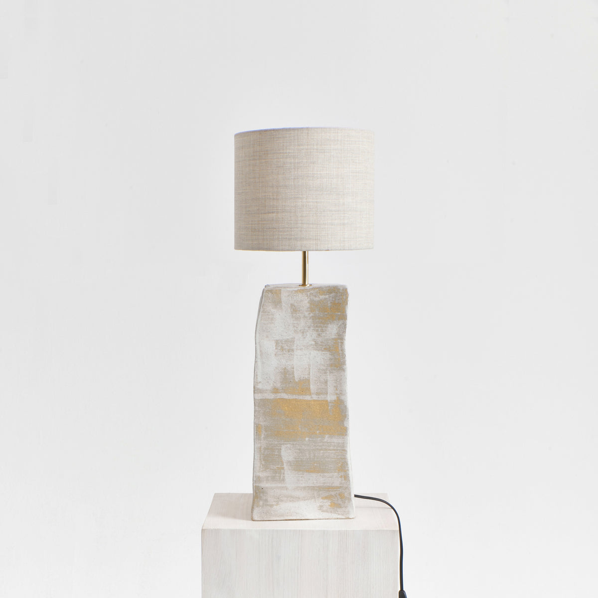 Rectangular Ceramic Lamp — front view on light wood pedestal