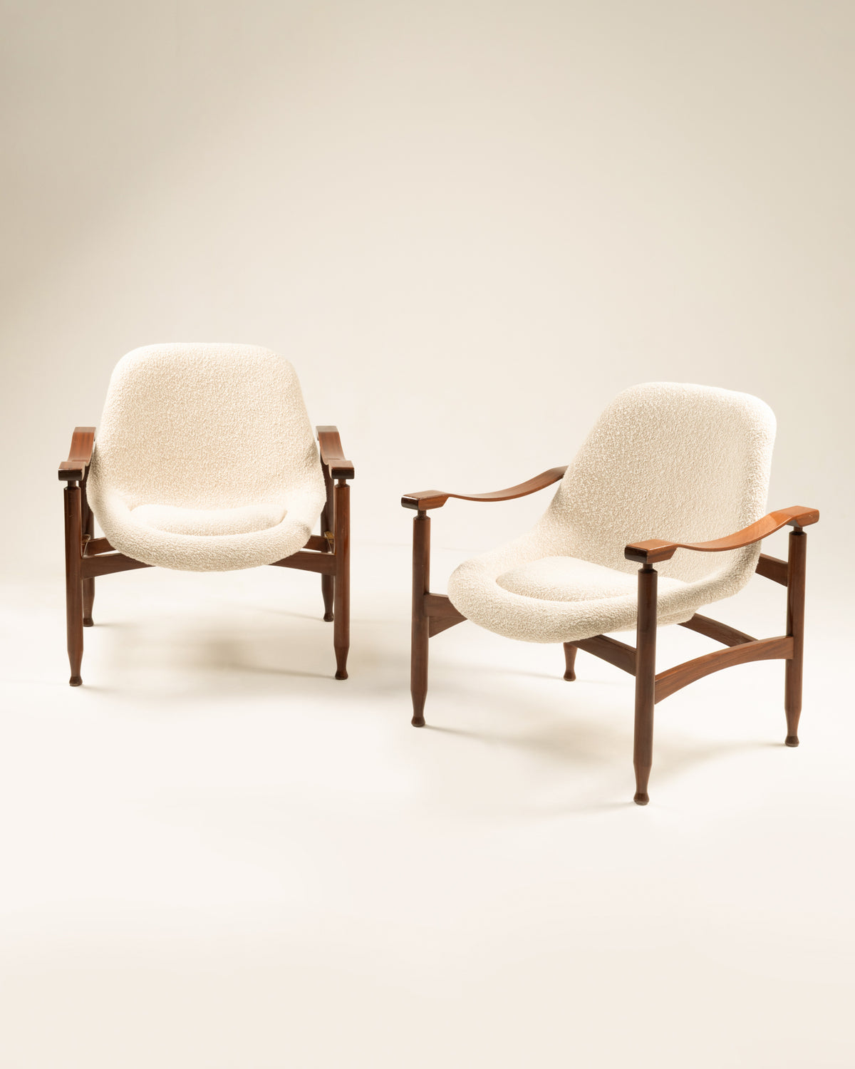 Pair of cream upholstered Tiki armchairs with walnut frames