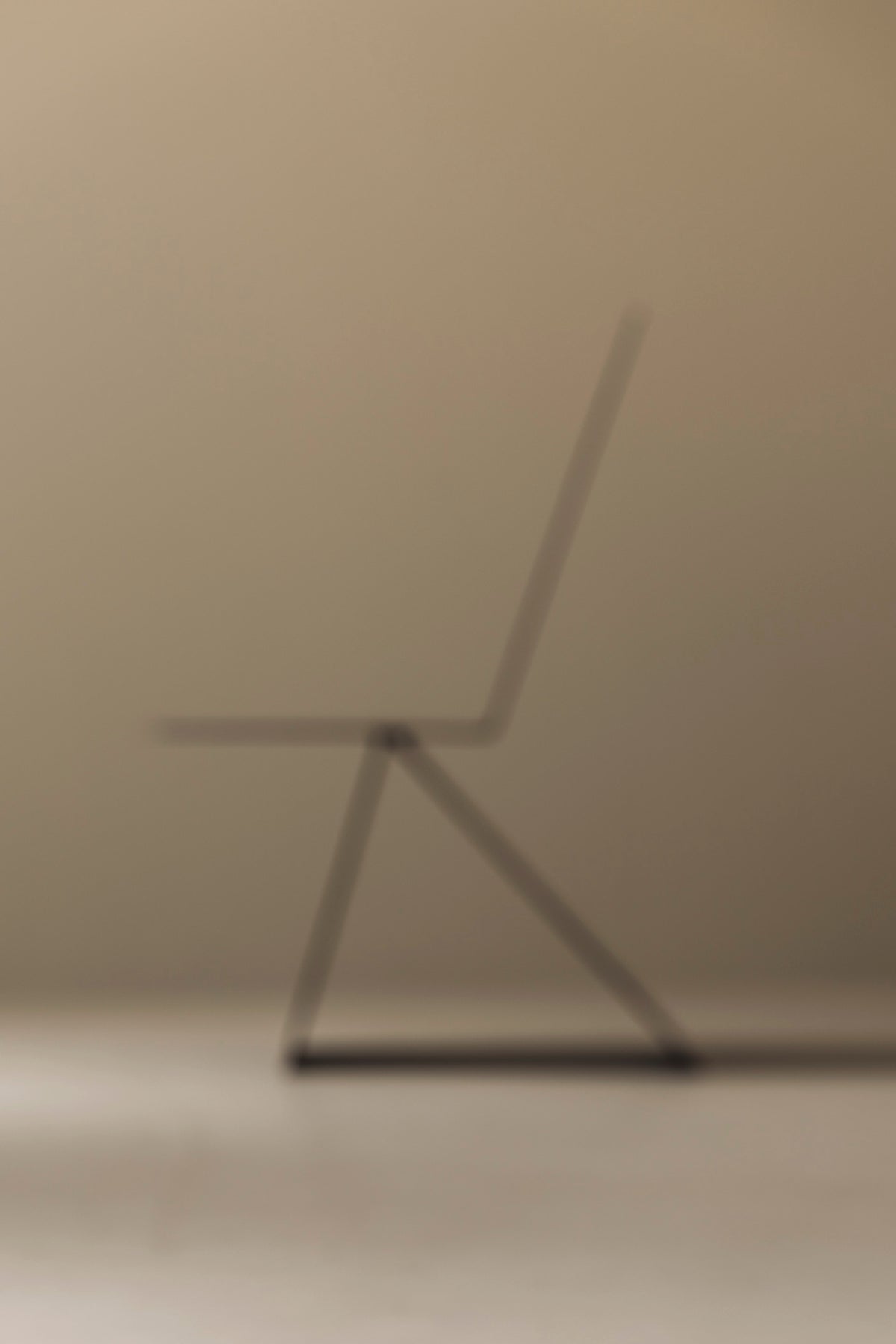 Prototype Modernist Architectural Side Chair, 1980s — blurred side profile against neutral background