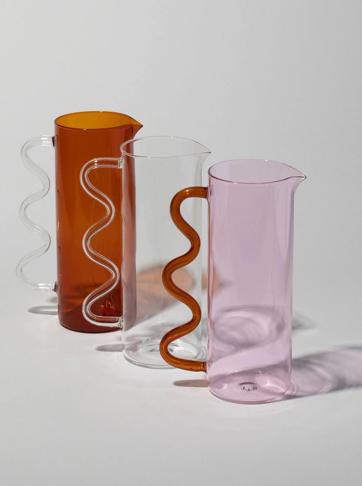 Wave Pitcher — side angle showing colorful glass and wavy handles