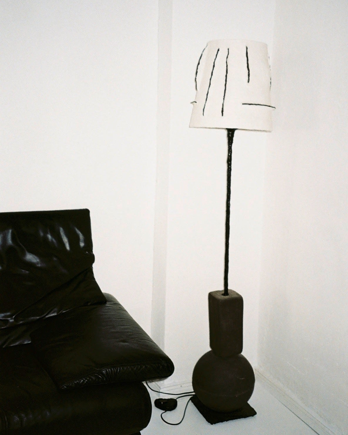 Rebirth II floor lamp with sculptural base in modern living room