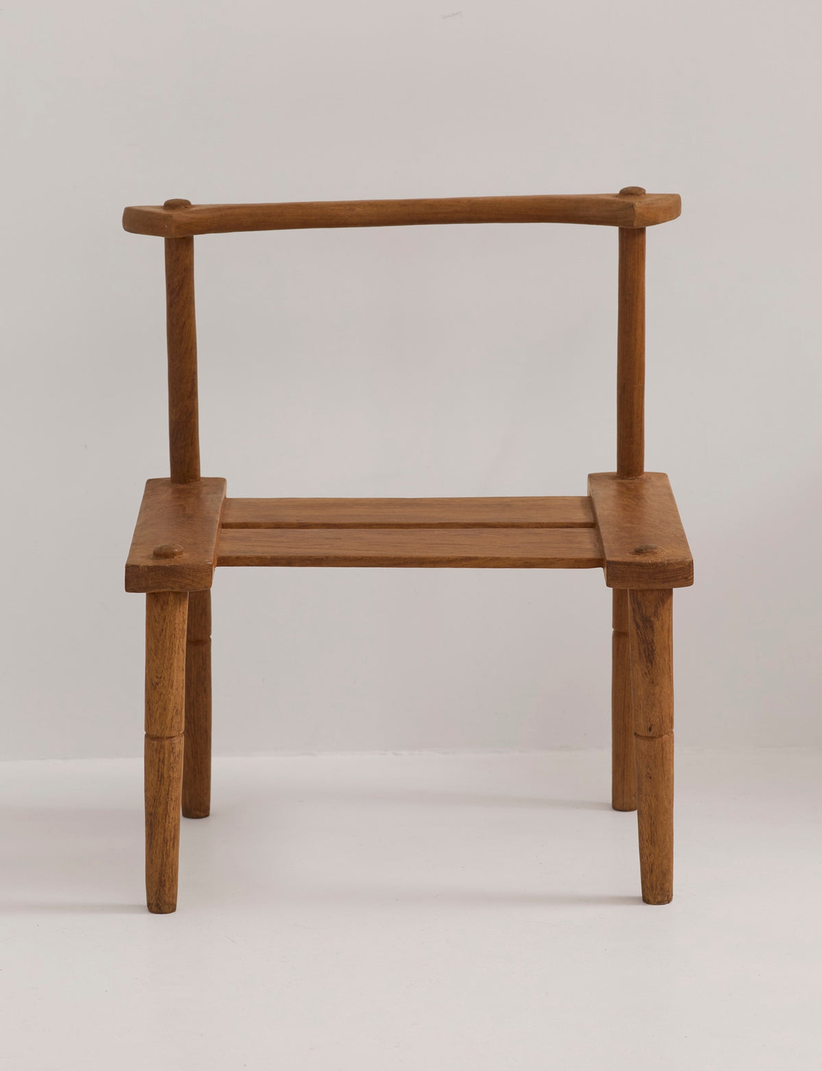 Large one-of-a-kind Baoulé chair in solid wood — lifestyle setting