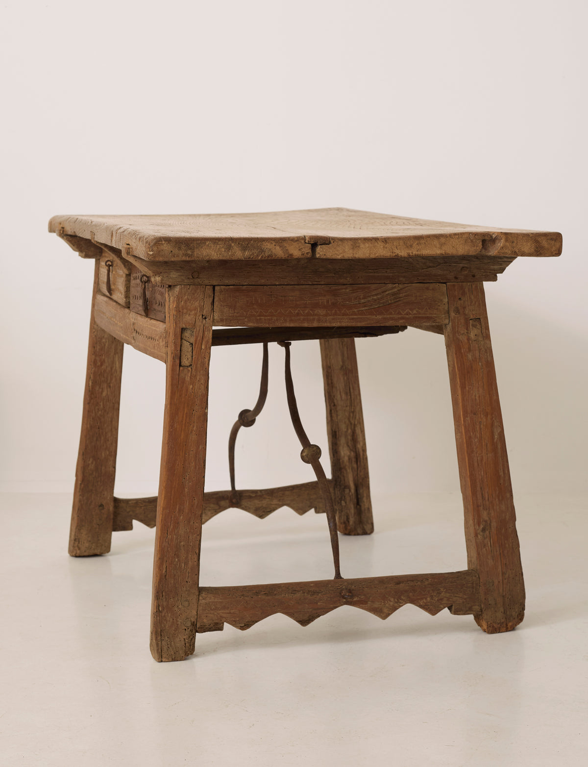 Spanish Folk Vernacular Table From The 17th Century — angled view showing rustic wooden frame