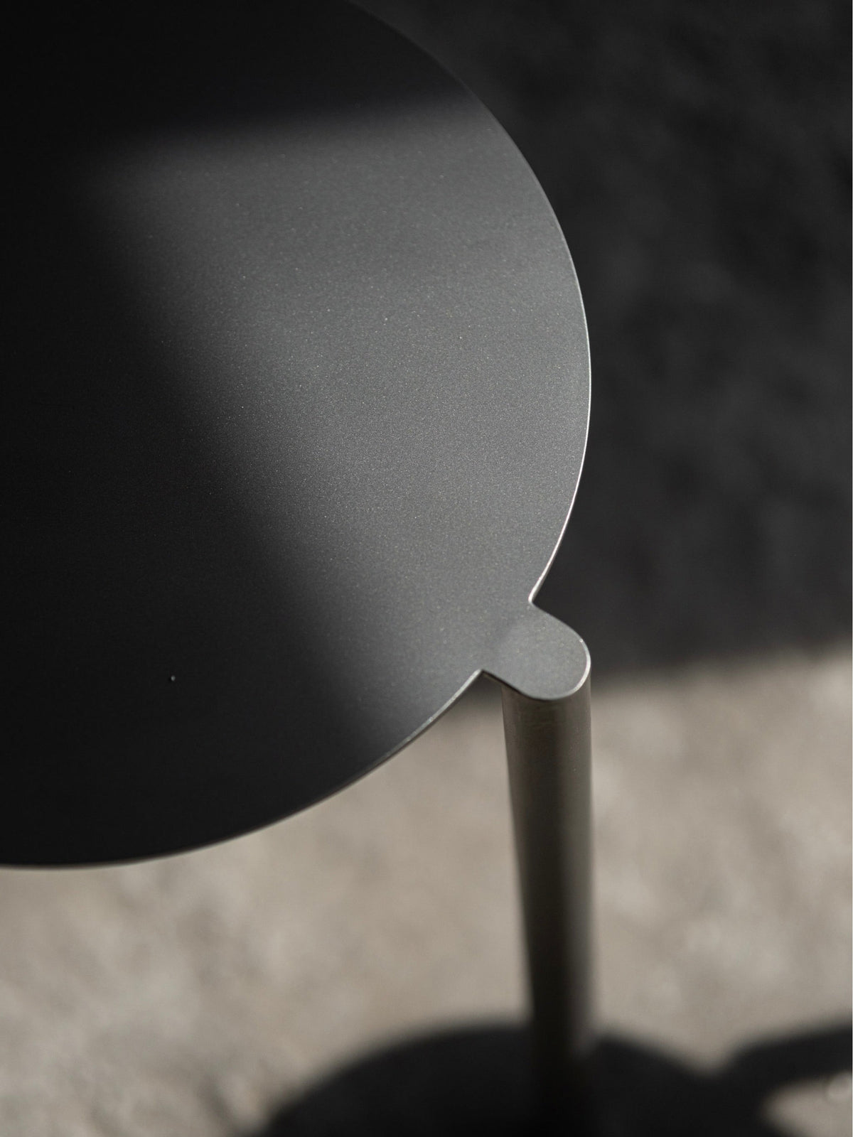 Stool - Isla x Paul Delrez - Stainless Steel — top view of round steel seat