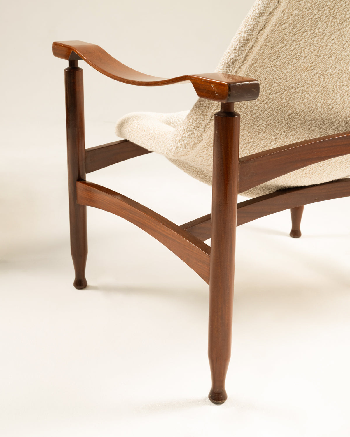 Carved walnut armrest detail of vintage Tiki armchair 1960s
