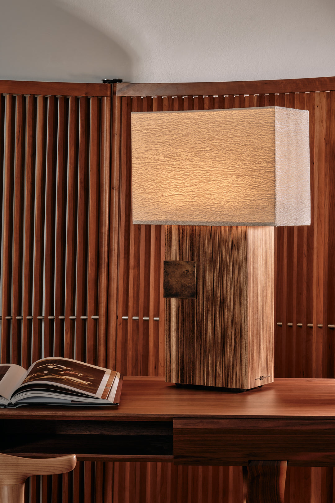 Pollux wooden table lamp with textured shade on modern desk