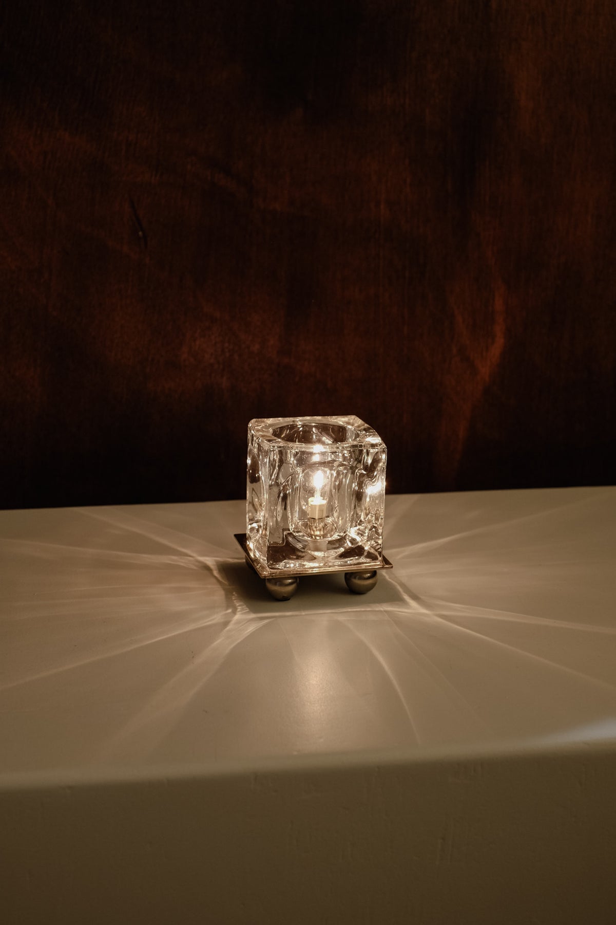 Ice Cube' Table Lamp — illuminated crystal lamp on white surface