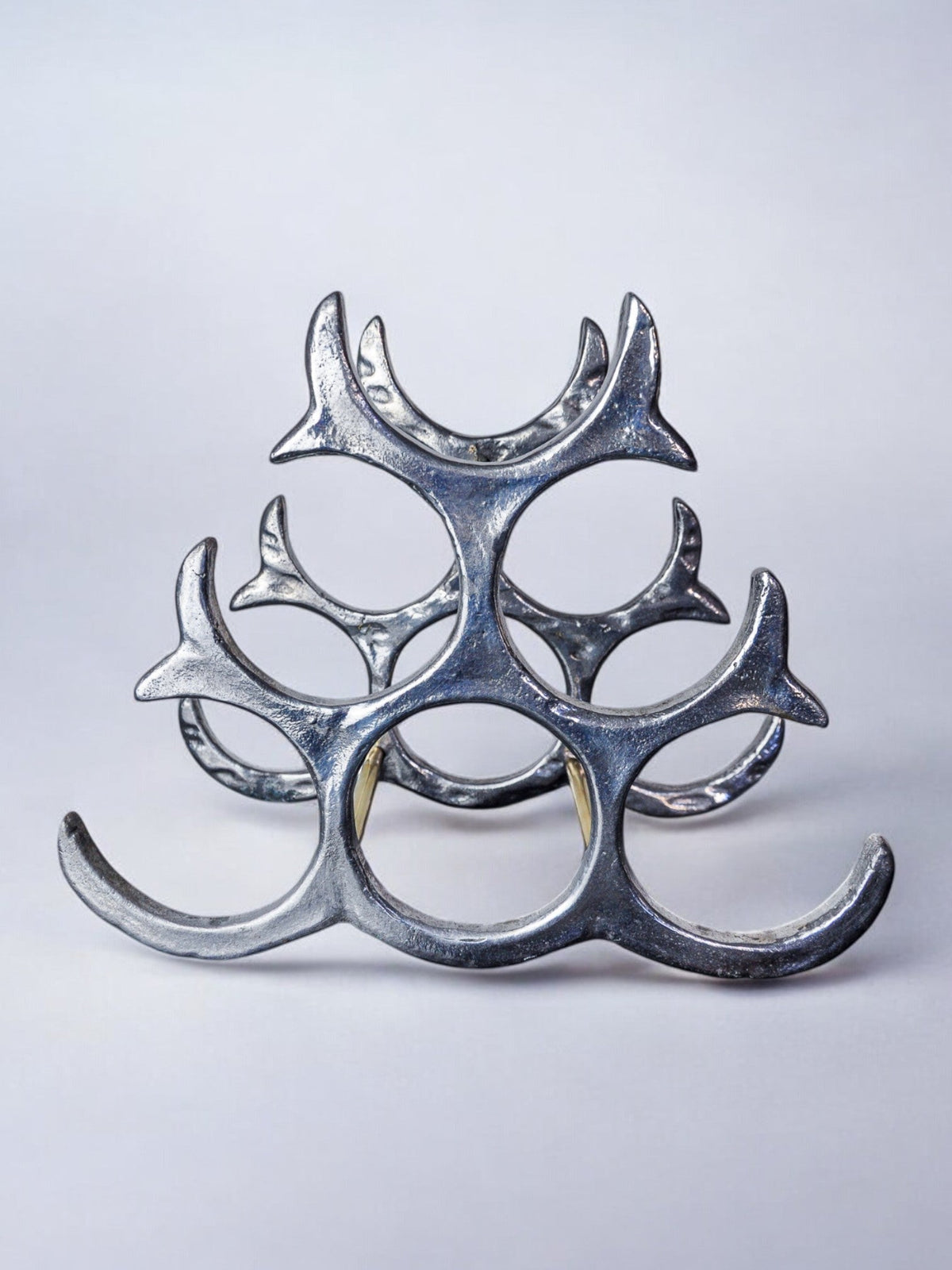 Brutalist bottle rack by Art3, Spain, 1980s — side angle showing metallic finish