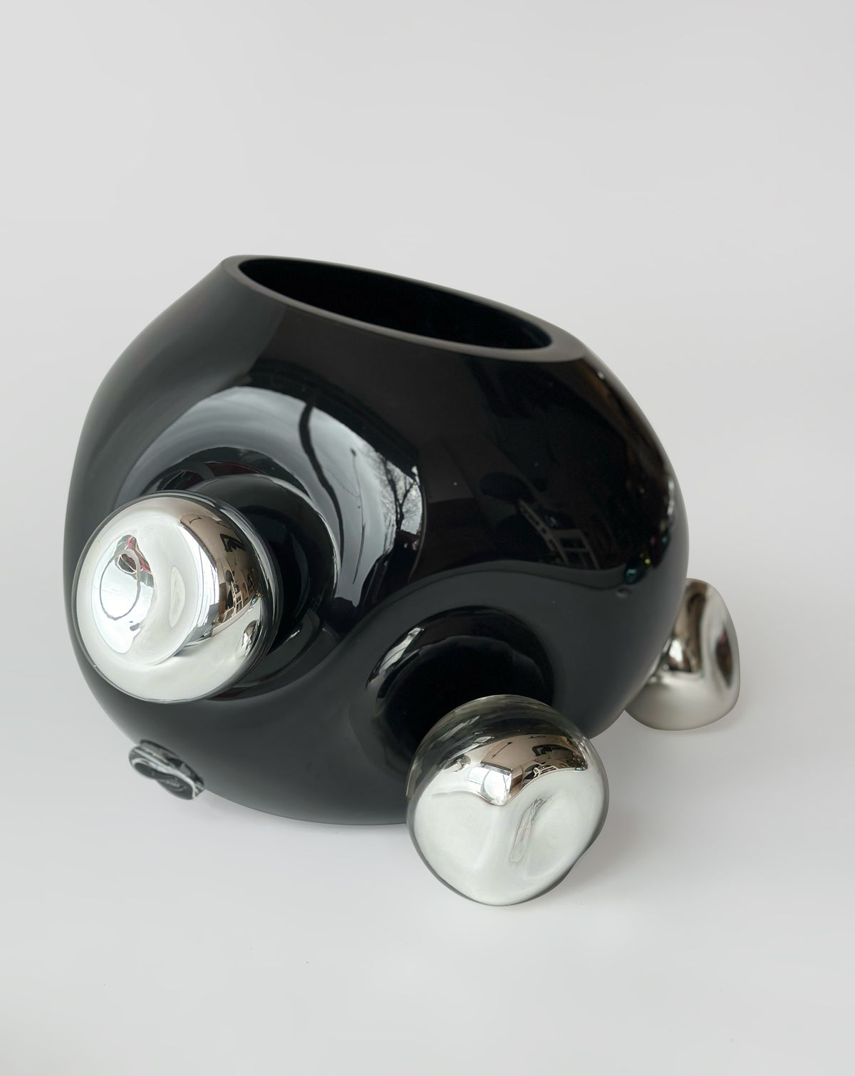 Bud Vase — top view of black ceramic with silver accents