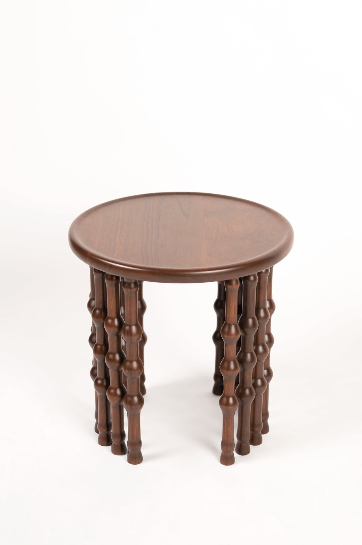 Arcus Side Table — back view of round wooden tabletop and legs