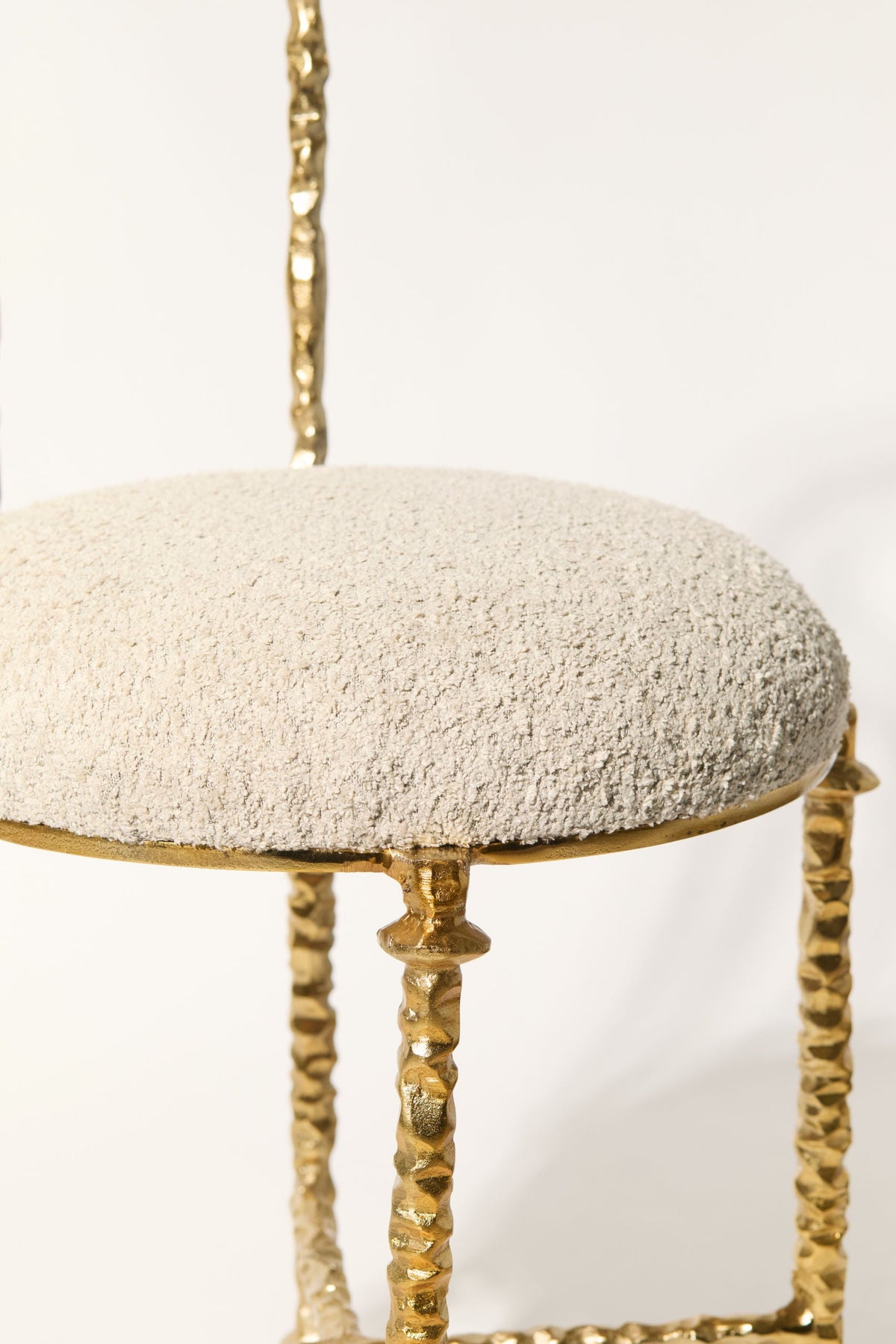 Aurelius' Cast Aluminum Chair — top view of textured cream seat