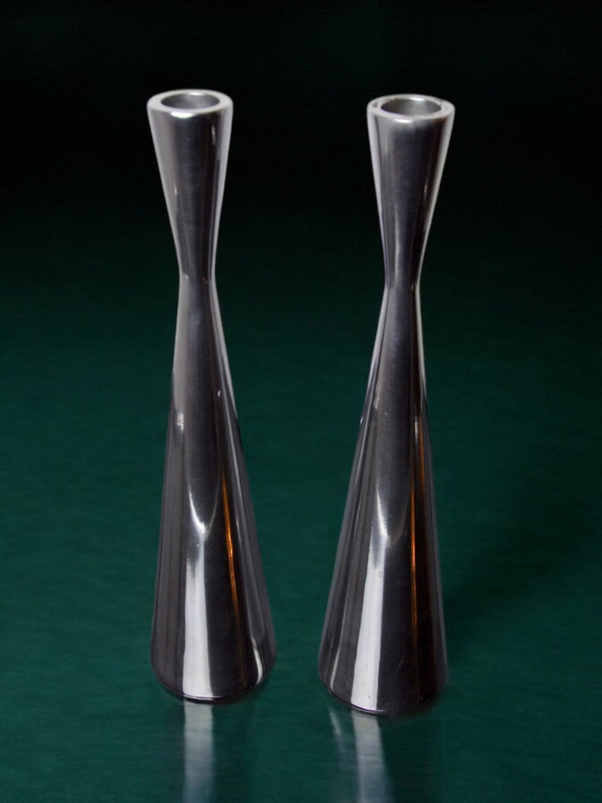 Pair of Scandinavian diabolo candlesticks, aluminium, suede, 1970 — side angle