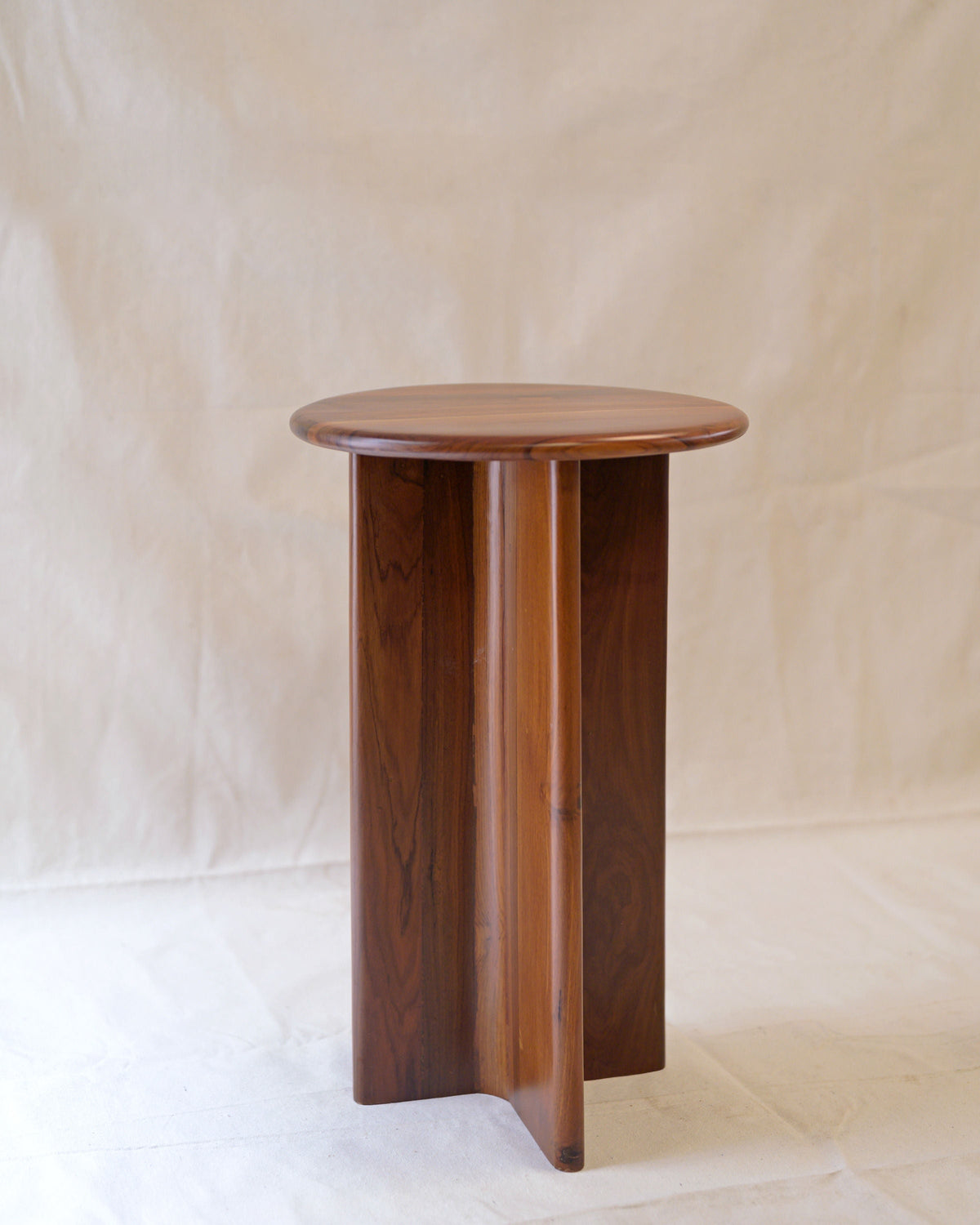 Nemo & Dory' Set of 2 Wood Side Tables — angled view of round wooden table
