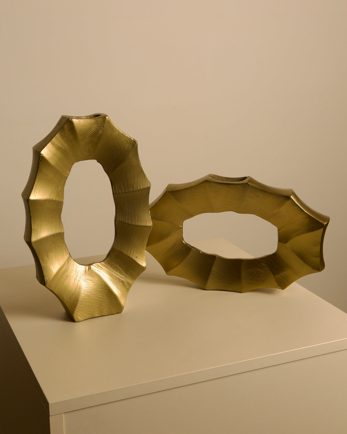 Pair of Italian 80s Gilt Aluminum Vases — close-up of textured gold surface