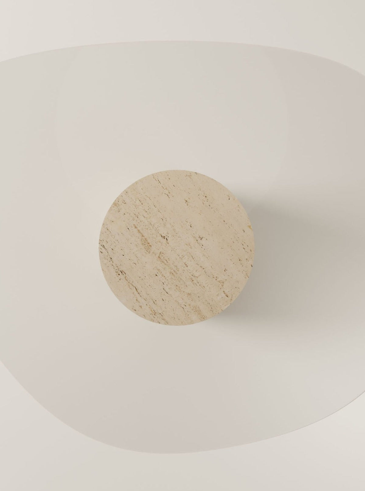 The UUfo 02 Dining Table by BURGIO. is a minimalist, modern piece with a round travertine top and an abstract white curved base, shown from above against a white background.