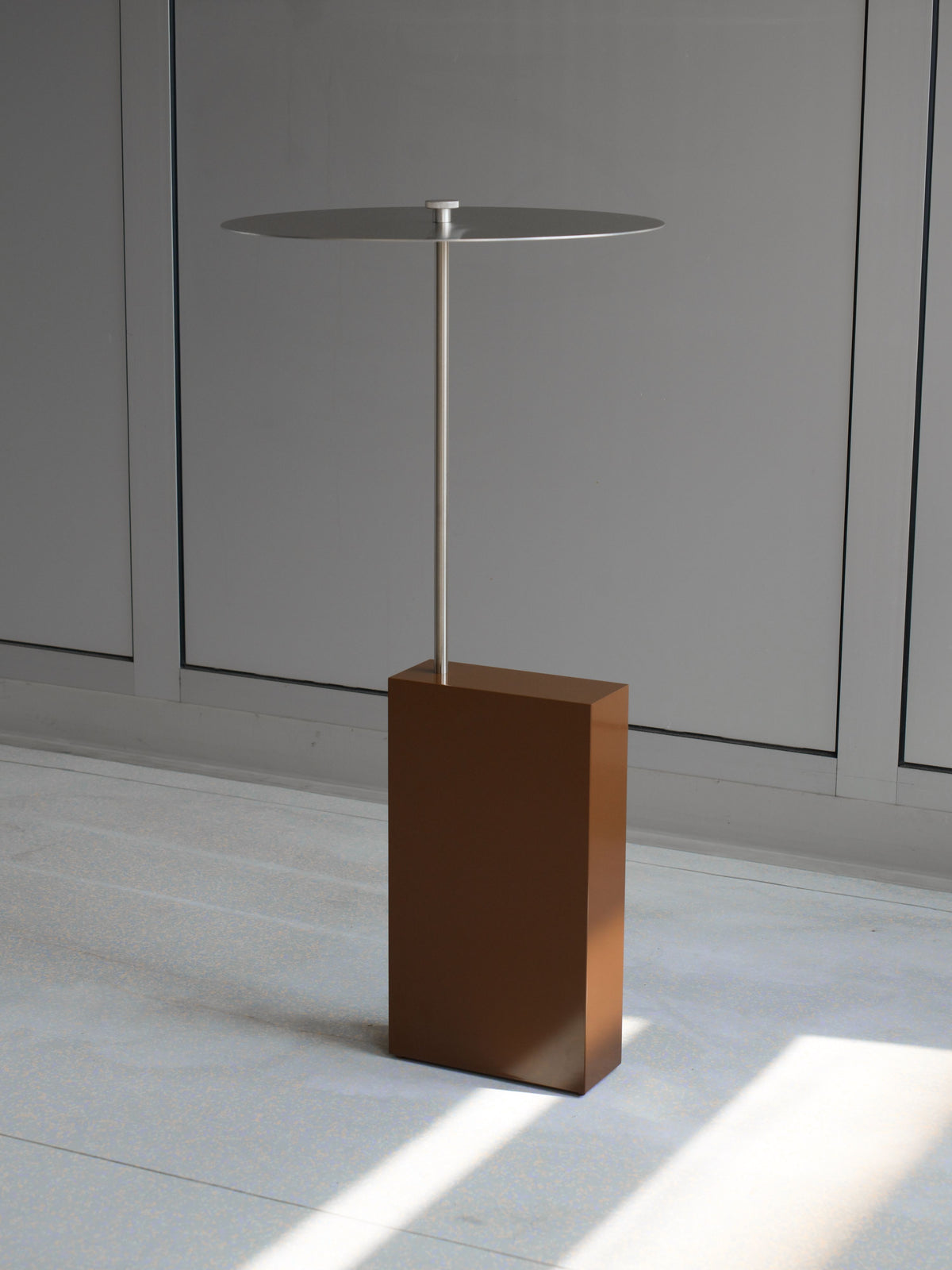 The Assistant' Side Table — back view of brown base and metal top