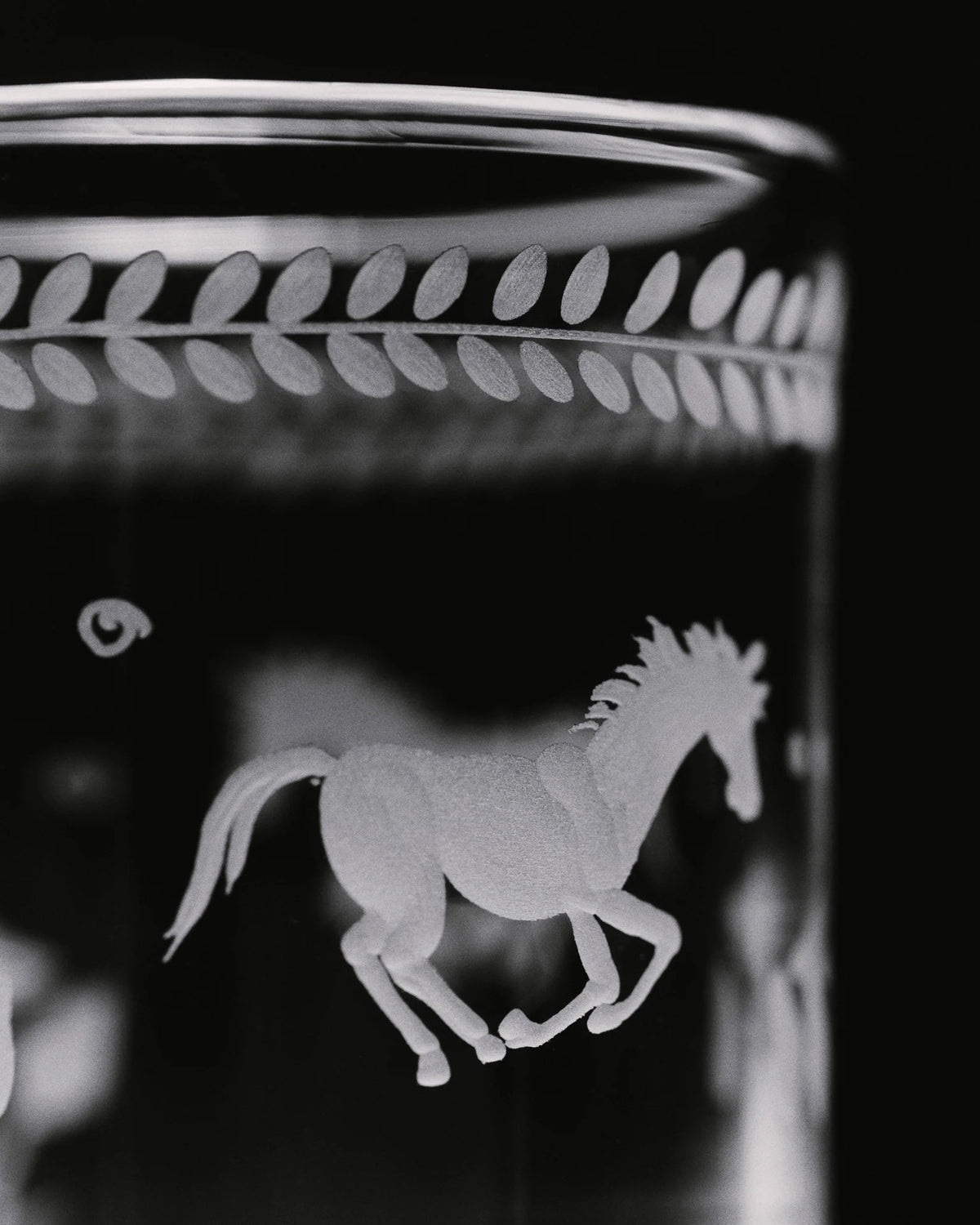 Barbro Water Glass - Set of four — close-up of etched horse design