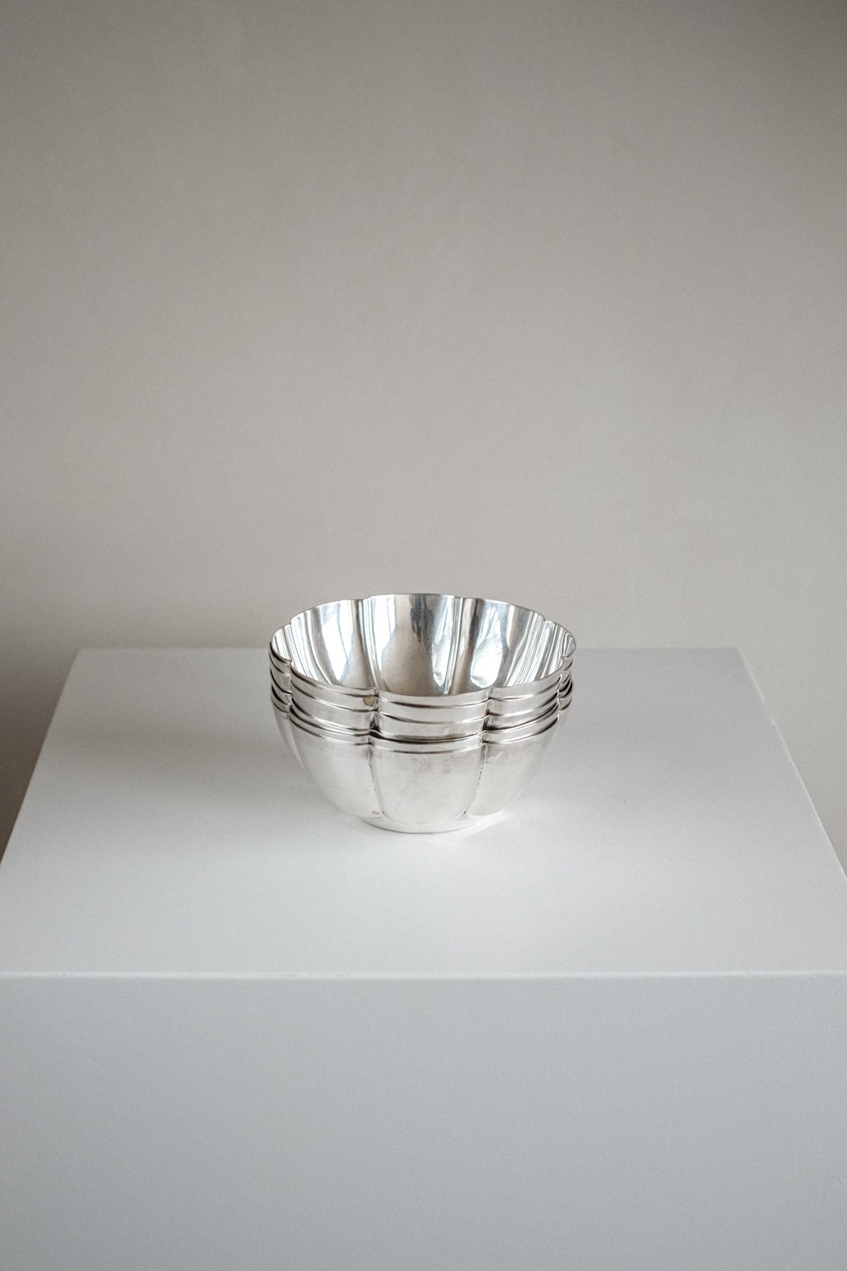 Set of 6 Silver-Plated Bowls 1960s — stacked bowls on white pedestal